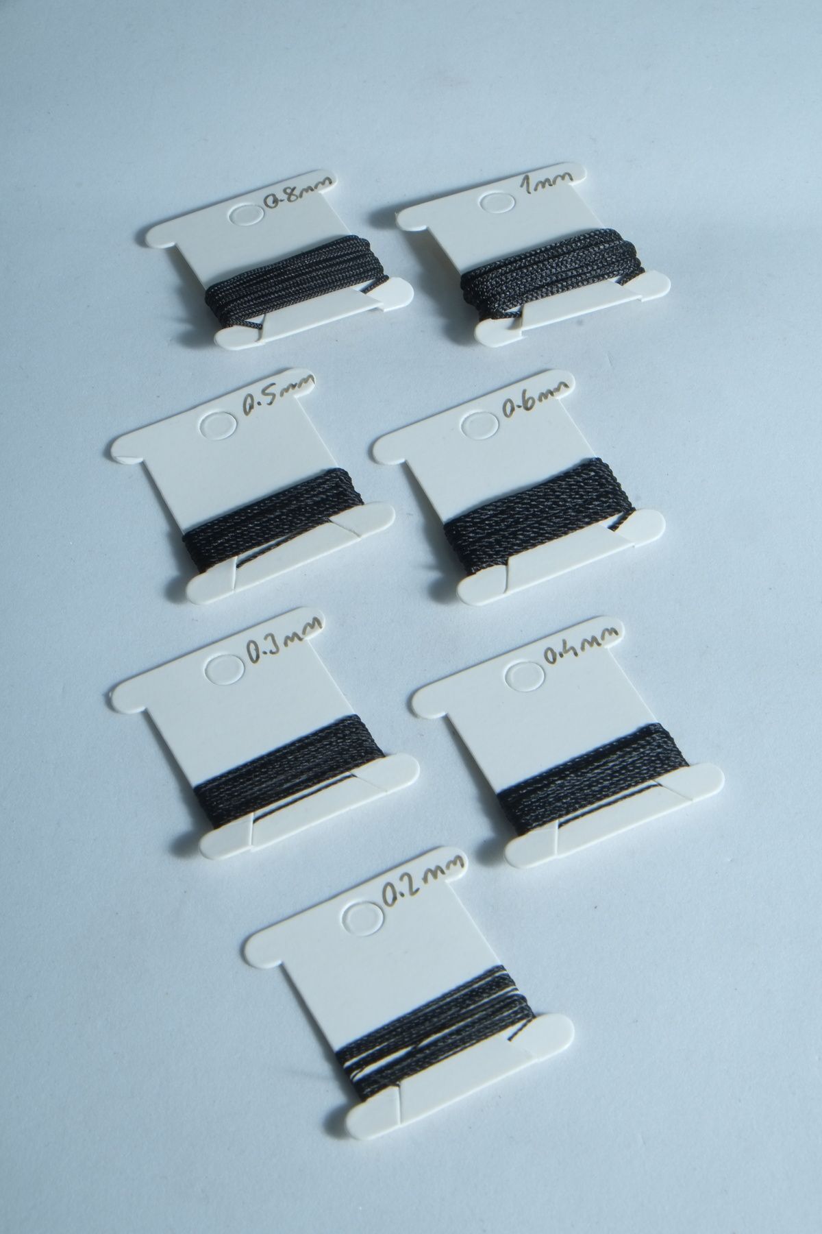 1 Metre 7 Ölçü Tesbih Ipi Seti 0.2 Mm 0.3 Mm 0.4 Mm 0.5 Mm 0.6 Mm 0.8 Mm 1 Mm Siyah Renk