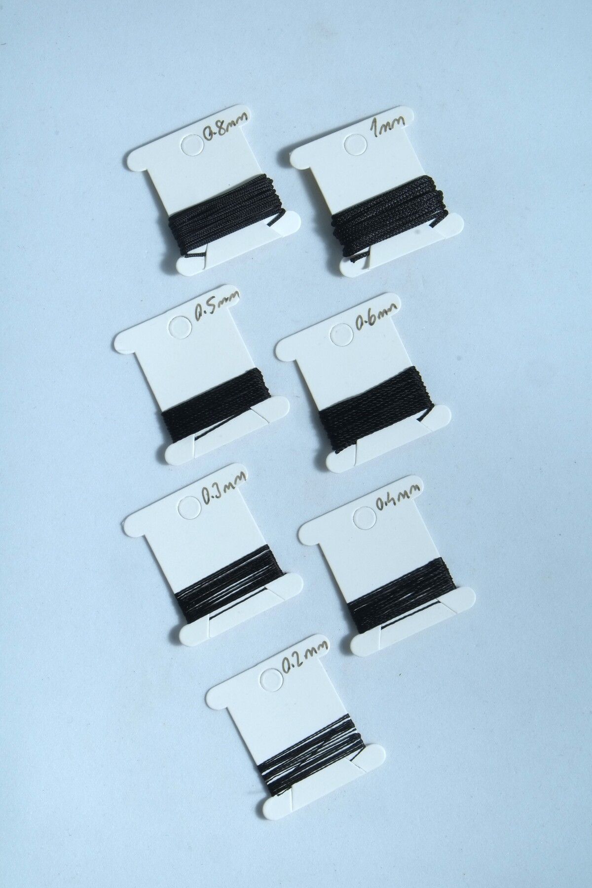 1 Metre 7 Ölçü Tesbih Ipi Seti 0.2 Mm 0.3 Mm 0.4 Mm 0.5 Mm 0.6 Mm 0.8 Mm 1 Mm Siyah Renk