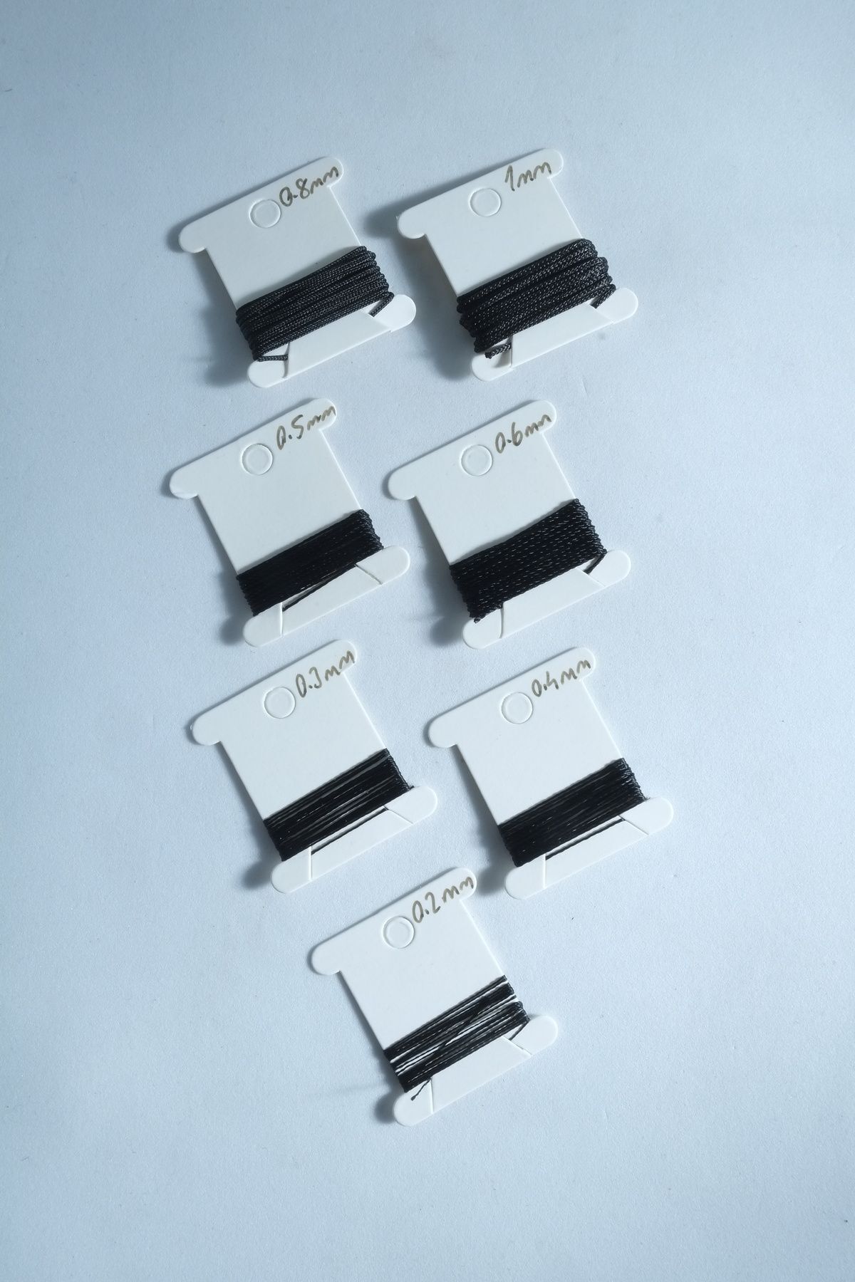 1 Metre 7 Ölçü Tesbih Ipi Seti 0.2 Mm 0.3 Mm 0.4 Mm 0.5 Mm 0.6 Mm 0.8 Mm 1 Mm Siyah Renk