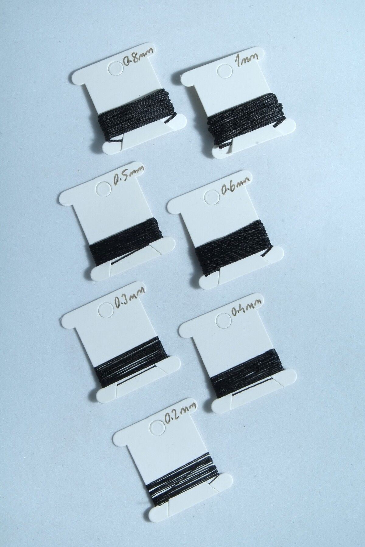 1 Metre 7 Ölçü Tesbih Ipi Seti 0.2 Mm 0.3 Mm 0.4 Mm 0.5 Mm 0.6 Mm 0.8 Mm 1 Mm Siyah Renk