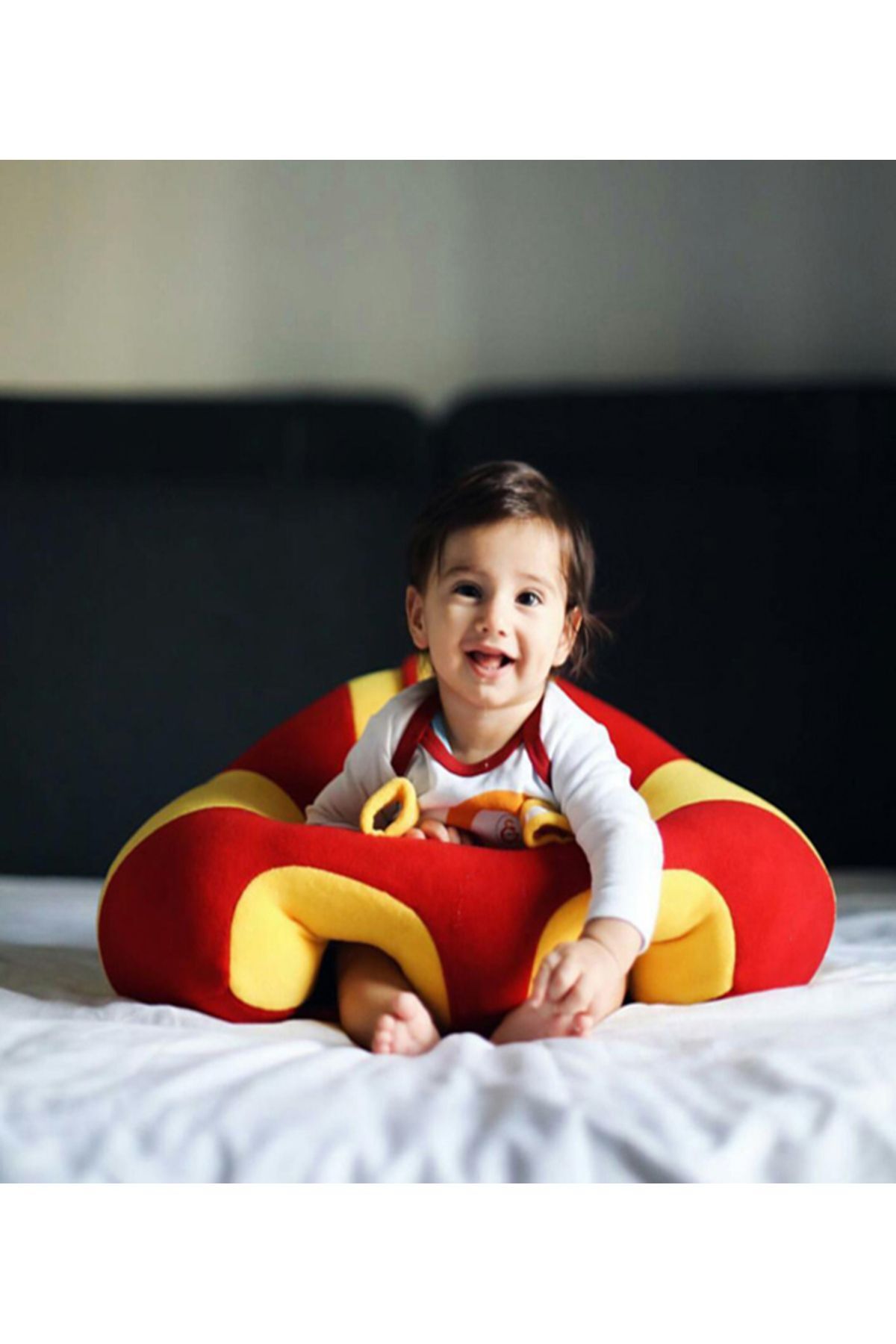 Red Yellow Baby with Rattle Toy Does Not Sleep