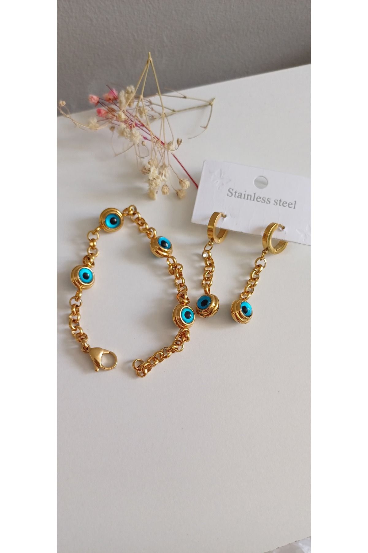 ÇELİK NAZARBONCUKLU BİLEKLİK VE ÇELİK KÜPE SET 316 L ÇELİKTİR KARARMAZ RENK ATMAZ GOLD