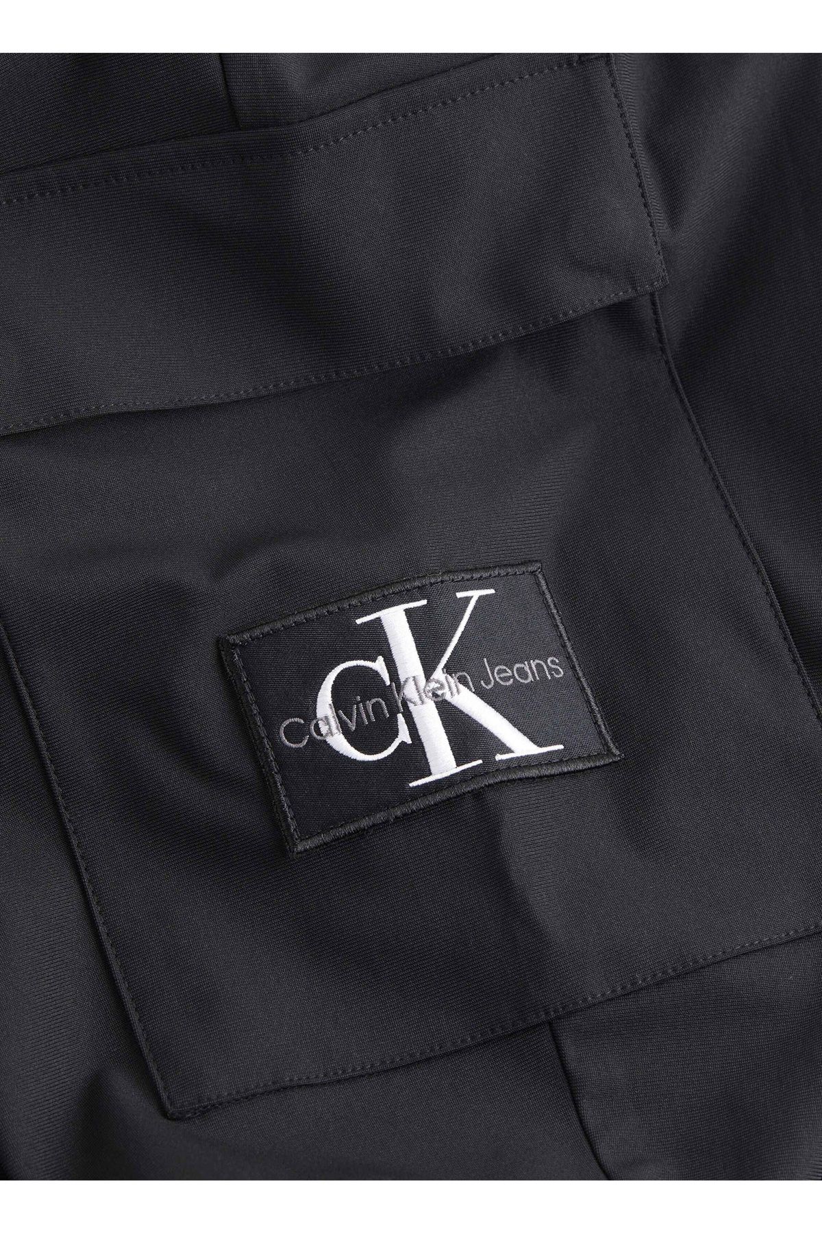 شلوار گرمکن مشکی مردانه جین لباس سیاه و سفید شش J30J325925BEH BADGE فنی HWK Calvin Klein