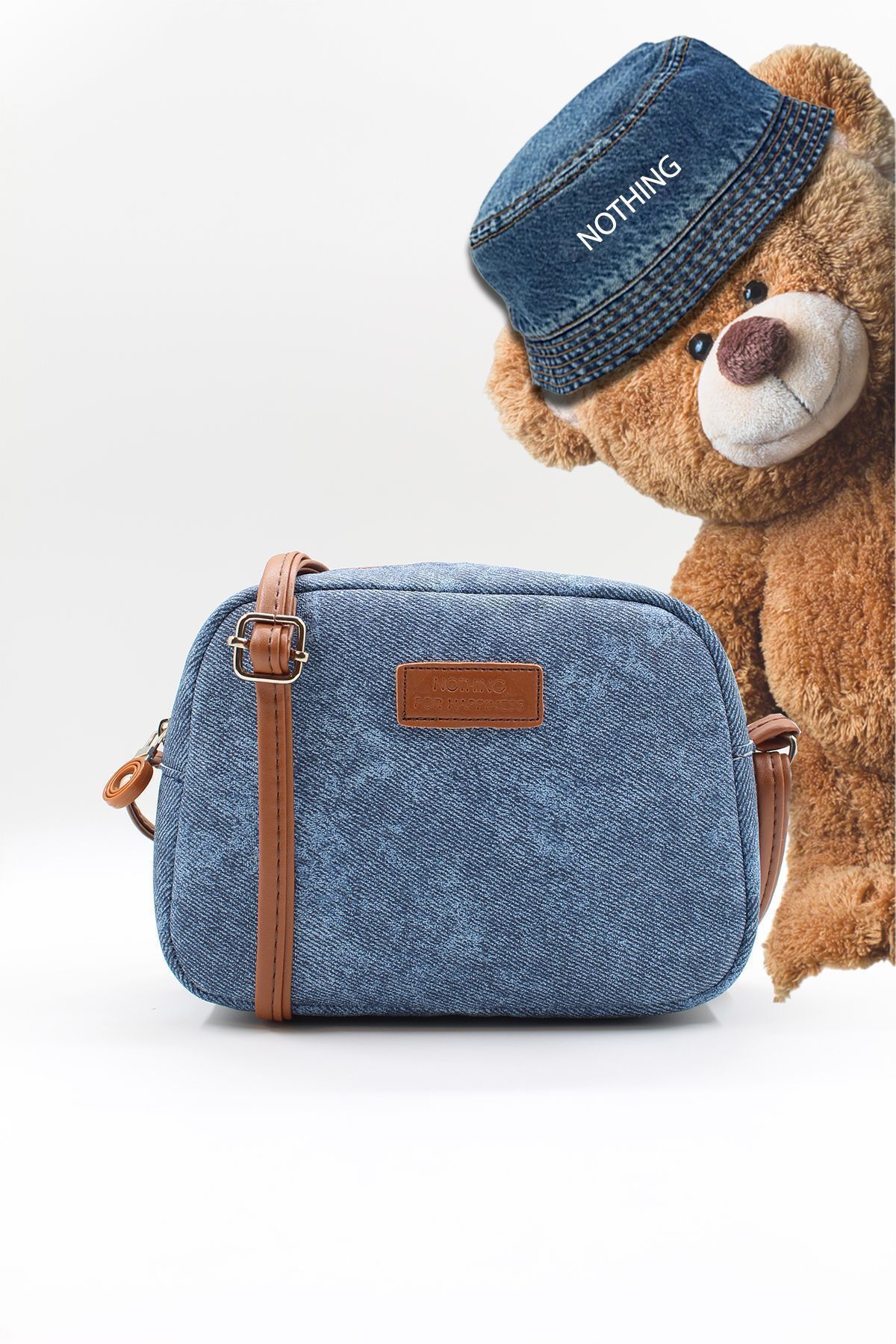 elle est mini urbanim jean kot modèle de fermeture éclair avec un porte manteau trapézoïde et un sac dépaules