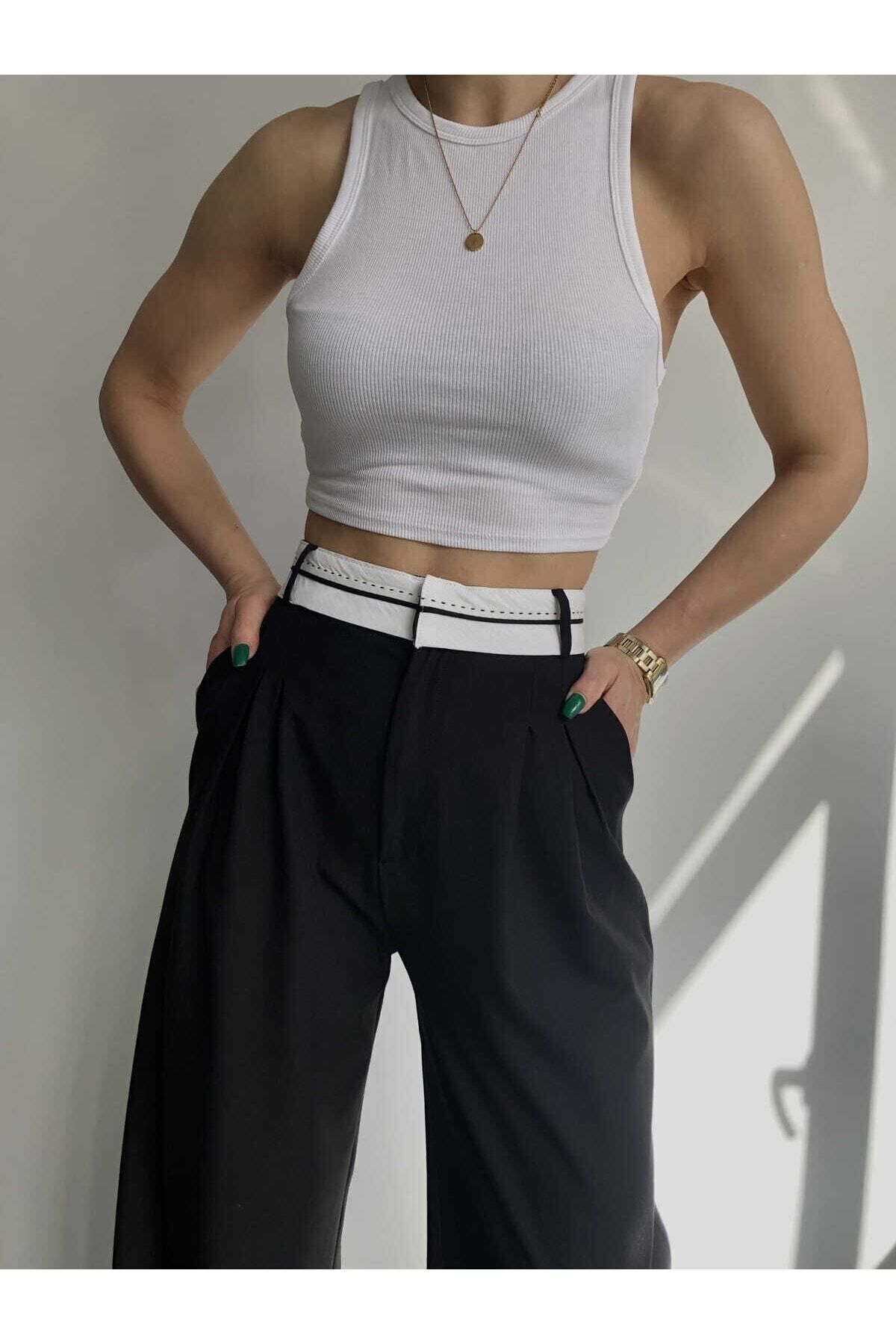 MAI STUDIOS CO. Spodnie damskie Maiden w kolorze czarnym z paskiem od tyłu