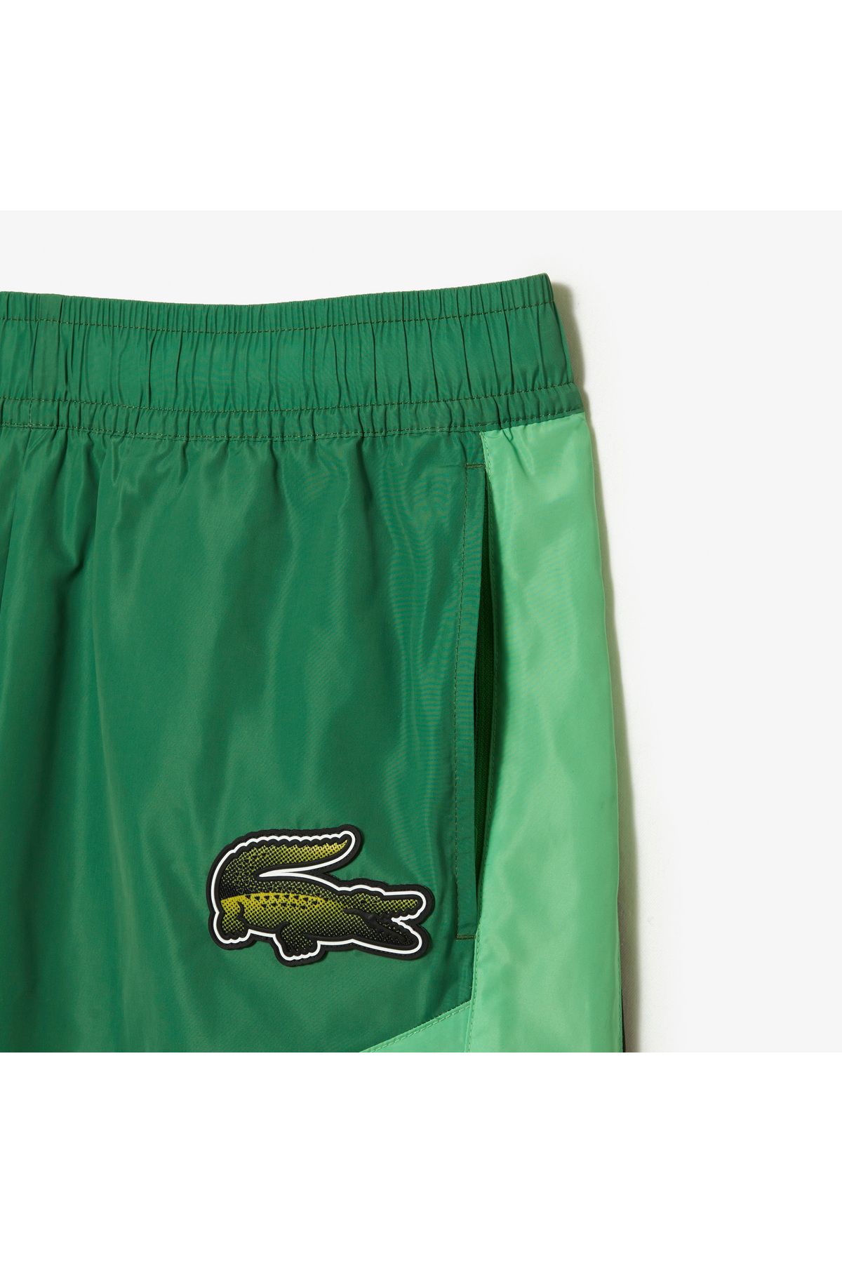 شلوار گرمکن سبز مردانه فعال Tapered Fit طرح دار شش Lacoste