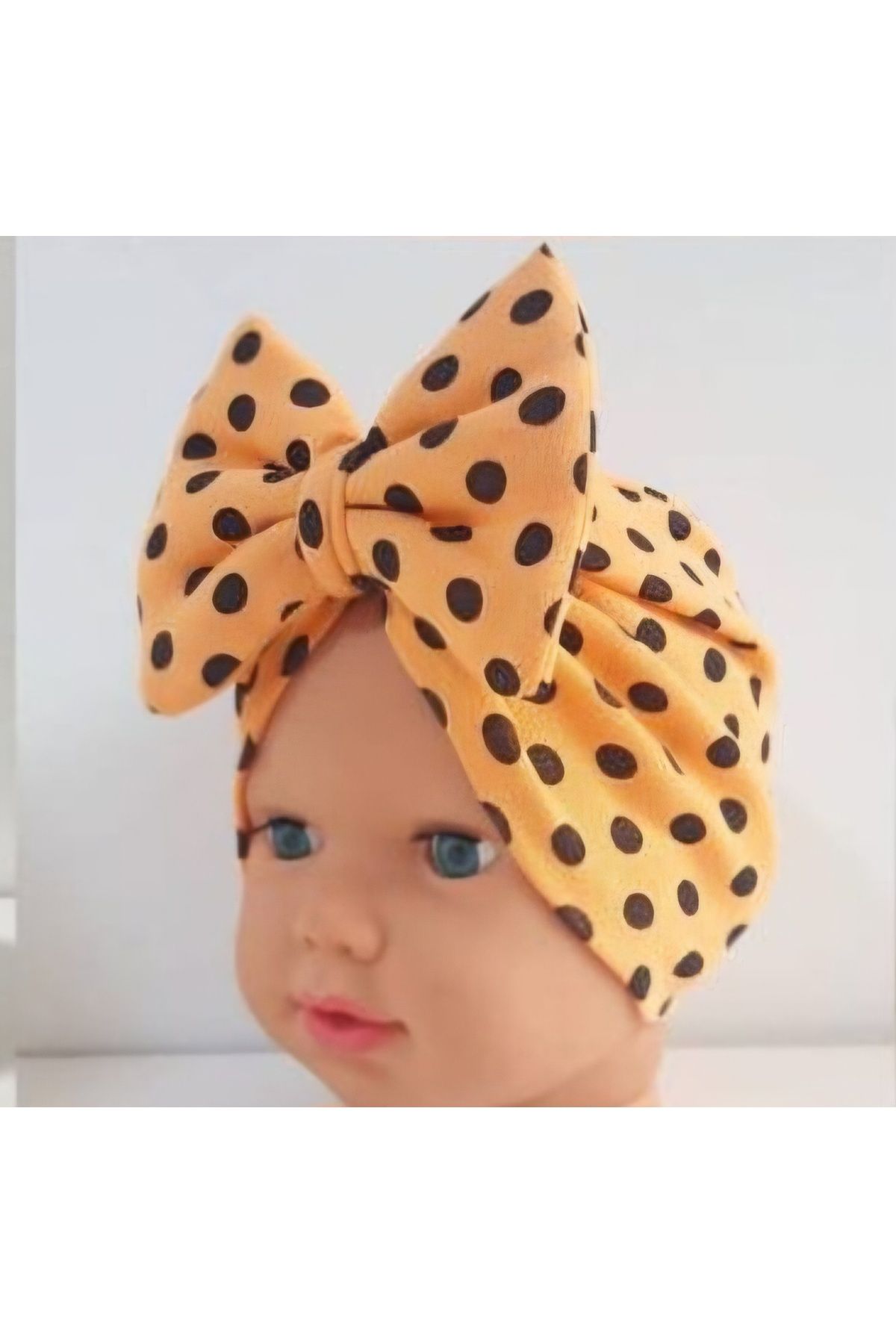 Baby bonnet bandana with polka dot patterned bow