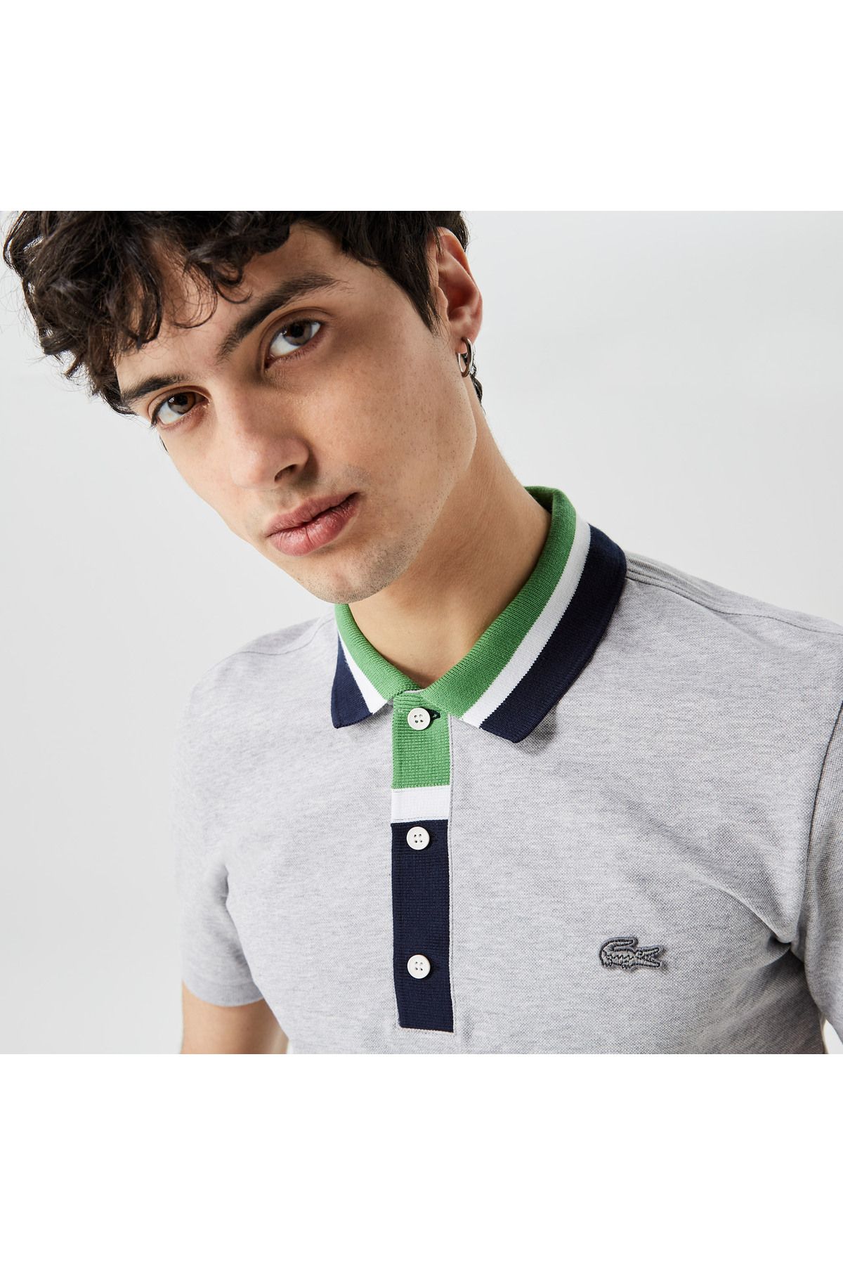 تی شرت یقه پولو خاکستری مردانه بلوک رنگی مناسب چوگان Lacoste