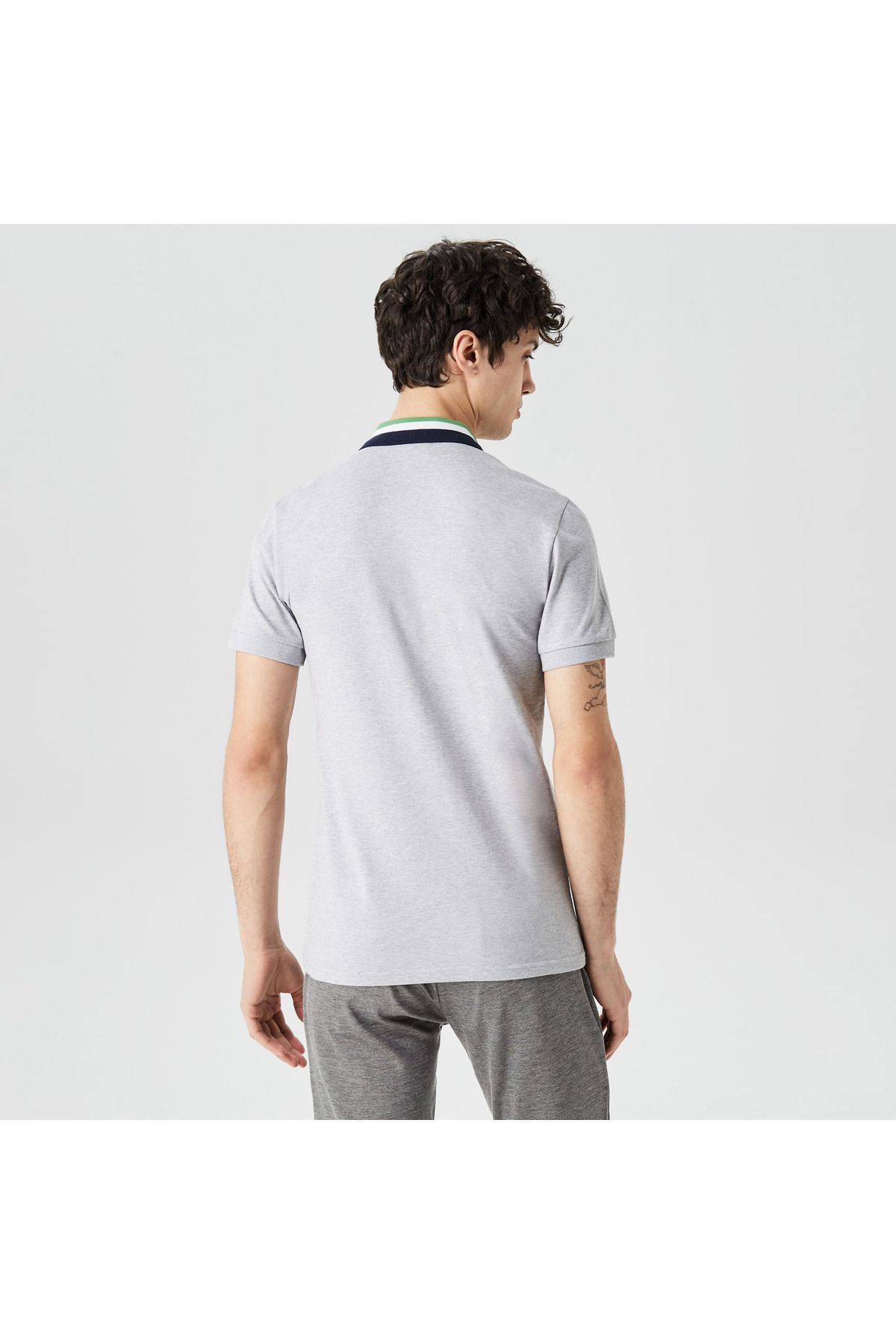 تی شرت یقه پولو خاکستری مردانه بلوک رنگی مناسب چوگان Lacoste