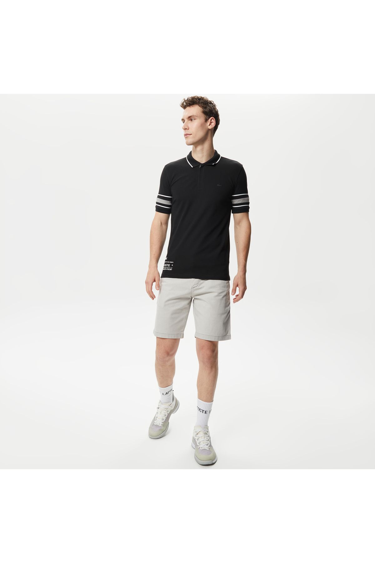 تی شرت یقه پولو زرد مردانه فعال باریک و سیاه چاپی چوگان Lacoste