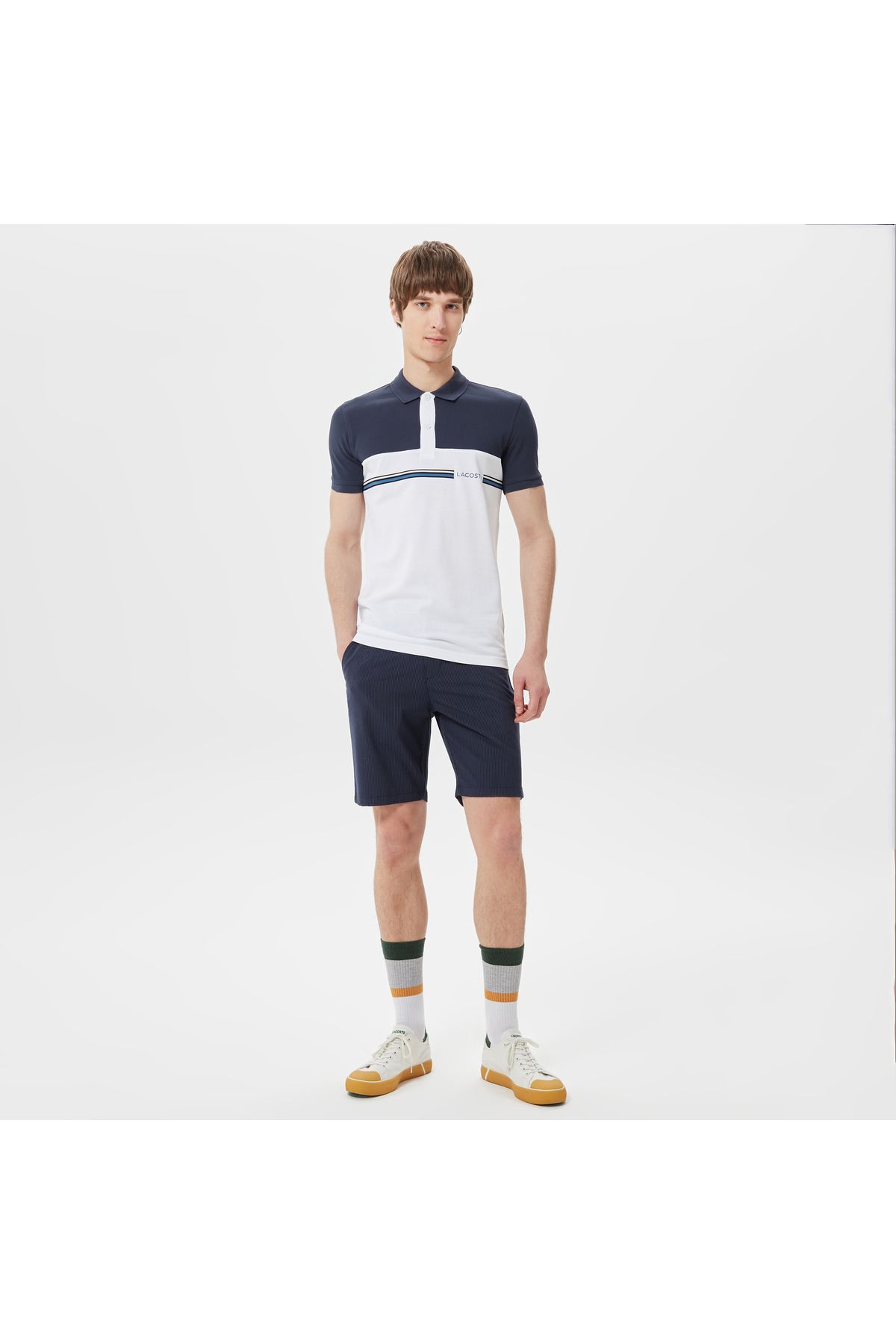تی شرت یقه پولو آبی مردانه بلوک رنگی باریک چوگان Lacoste