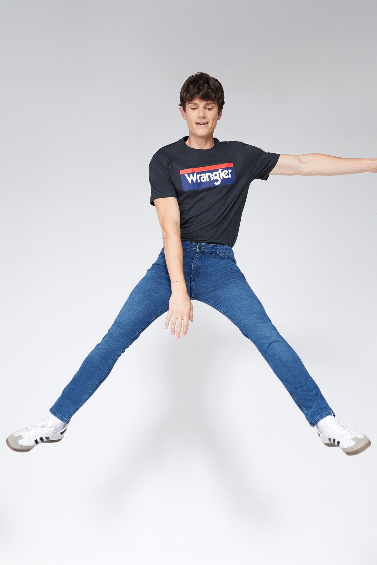 شلوار جین آبی مردانه تگزاس باریک و کمر انعطاف پذیر Wrangler