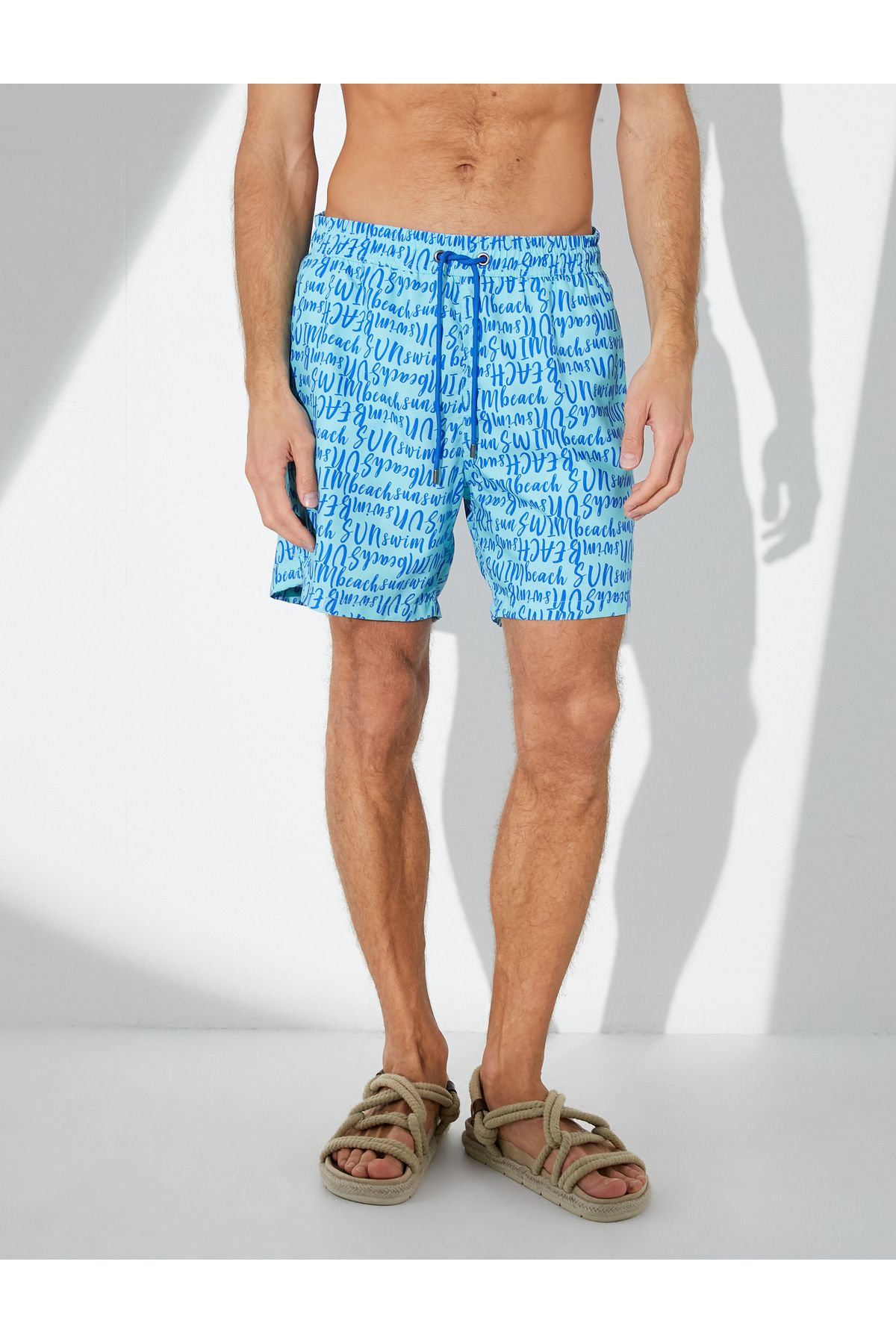 Koton-Swim shorts with text print, lacing at the waist and pockets 5