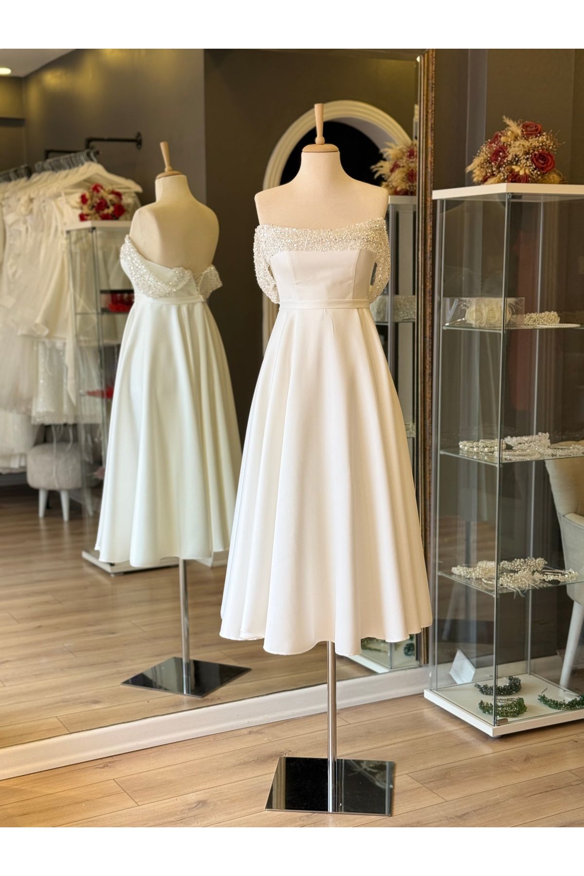white plastering lace detailed midi length low sleeve engagement and evening dress