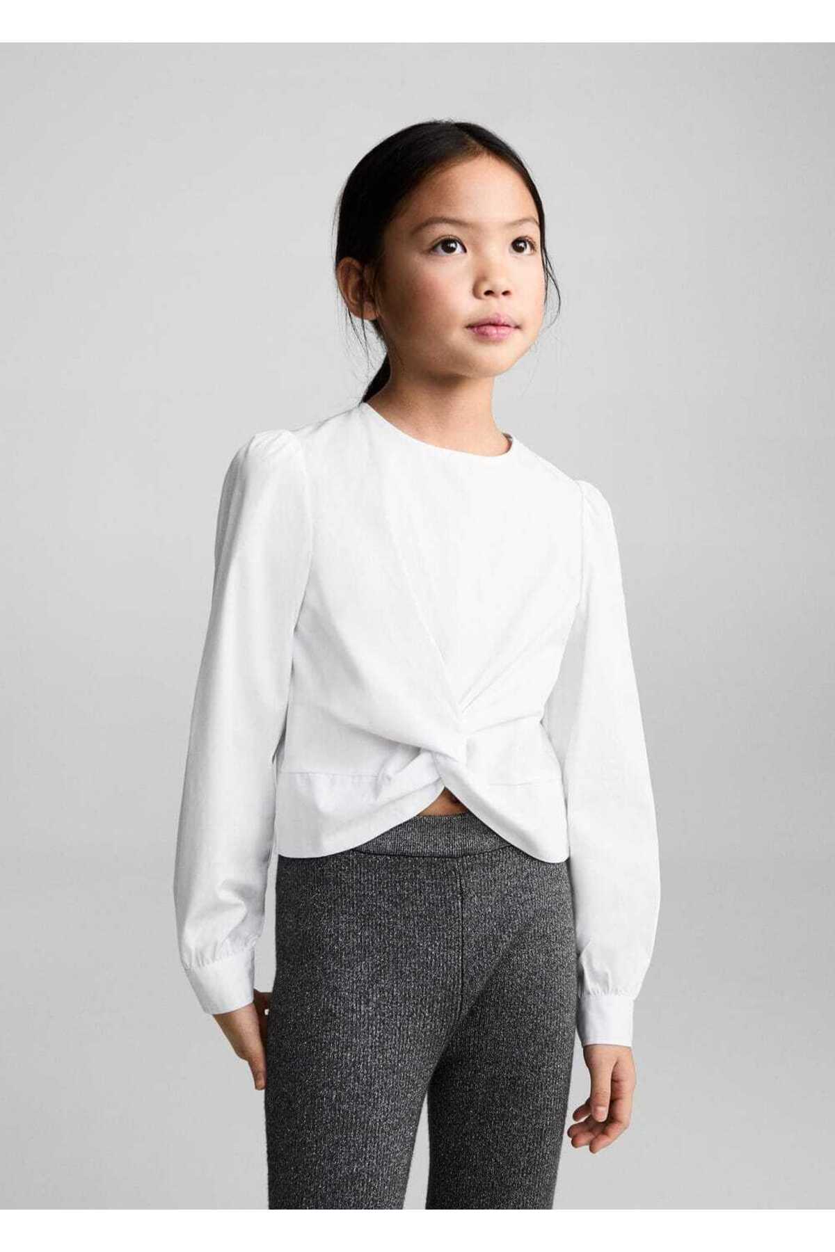 Etek kısmı düğümlü koton bluz