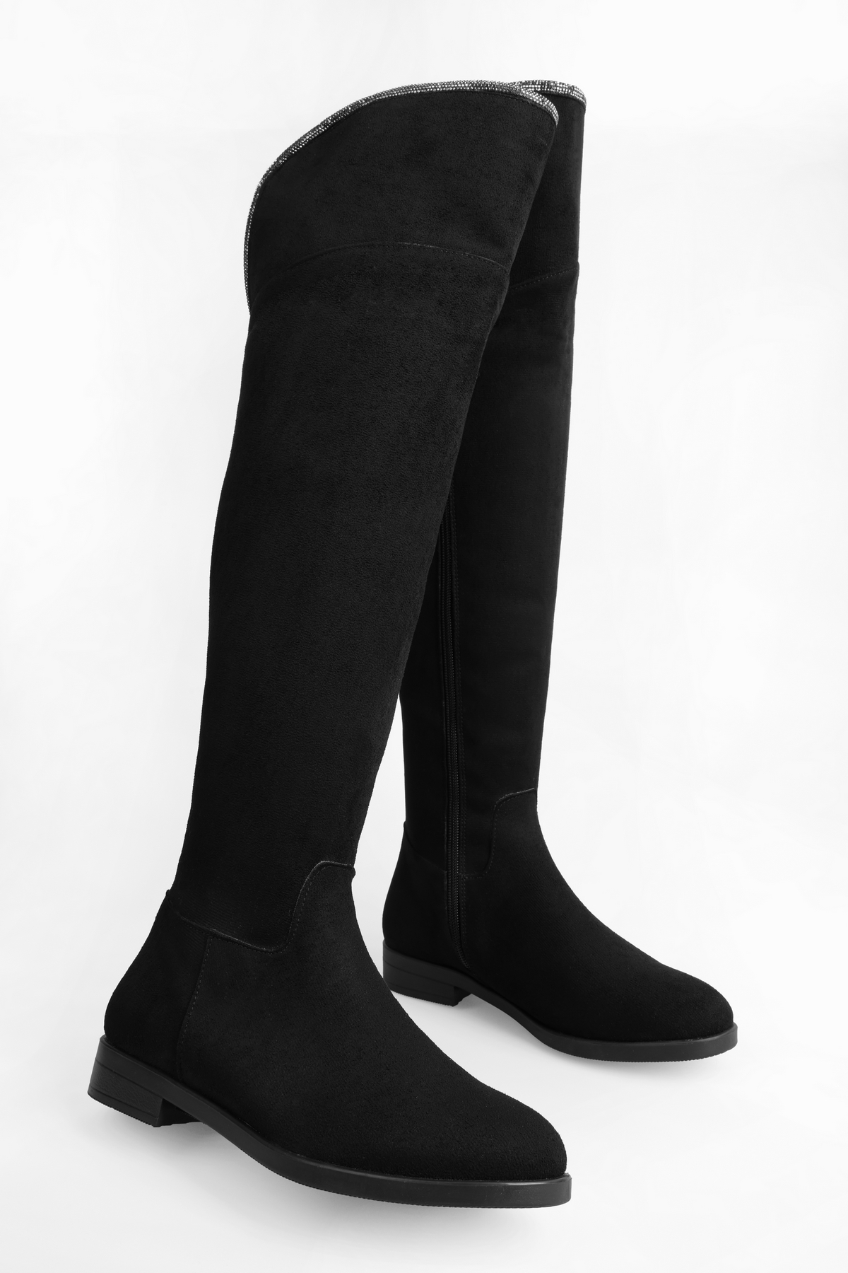 Women's boots toon made of black suede. Black suede
