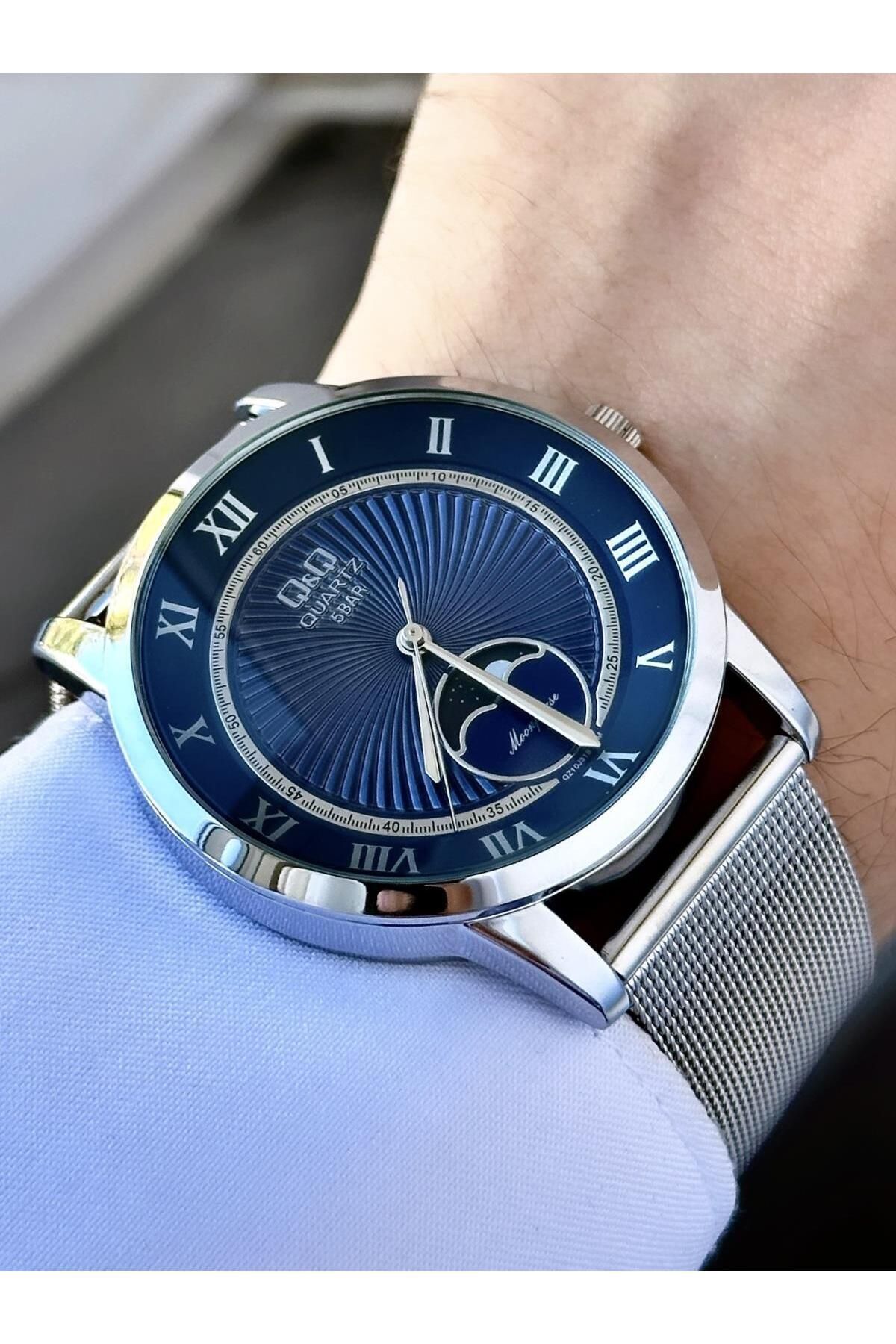 ساعت آنالوگ مردانه آبی با بند تور نقره‌ای و صفحه با جزئیات متحرک