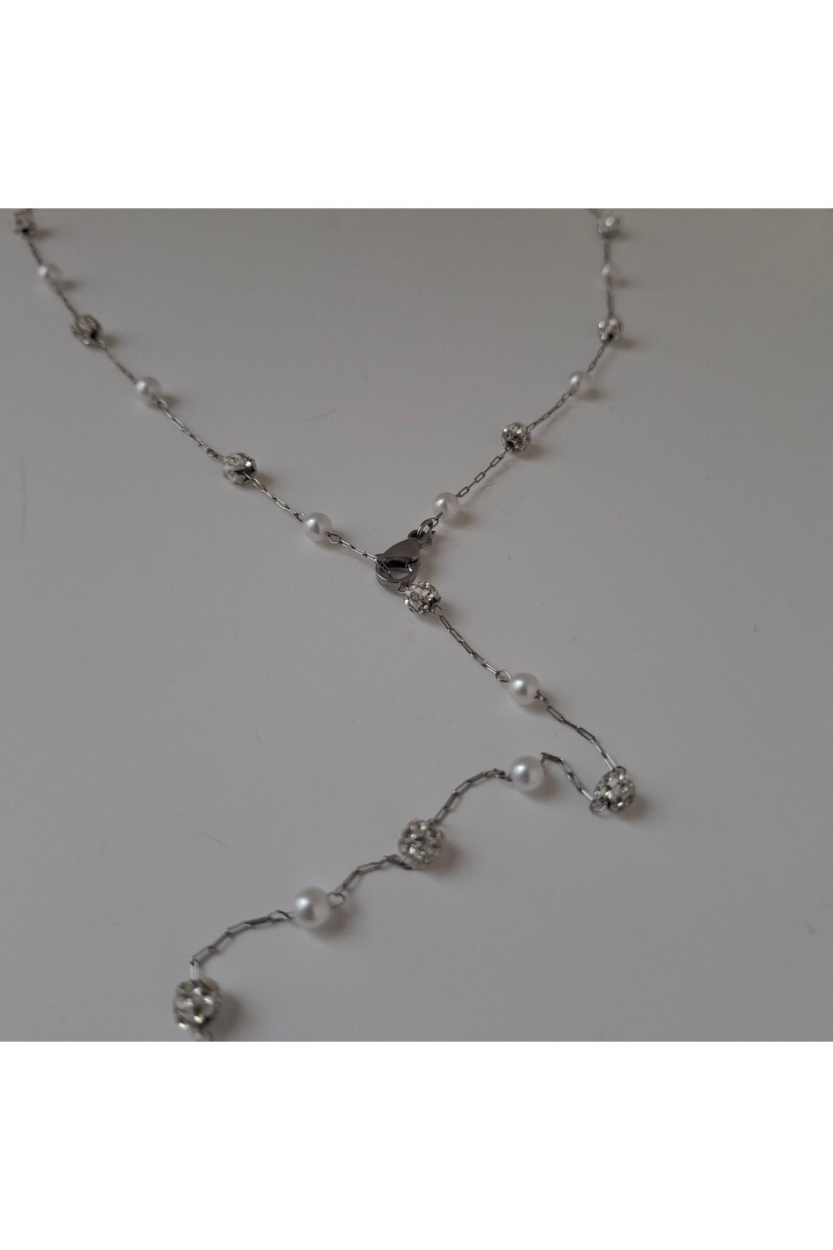 azra takı tasarım Y Kolye,el yapımı,Çelik ,zincirli yaklaşık 65 cm incili ,plaj ,kadın kolye