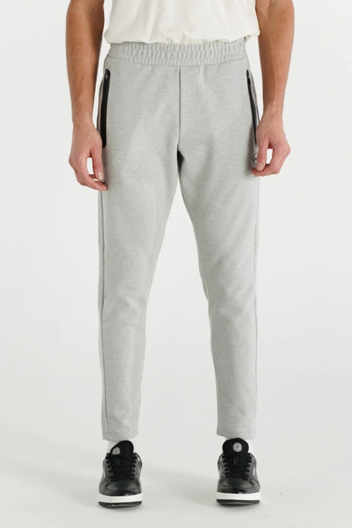 hummel 931276-2006 HMLINTER PANTS Gri Erkek Fermuarlı Cep Dar Paça Eşofman Altı