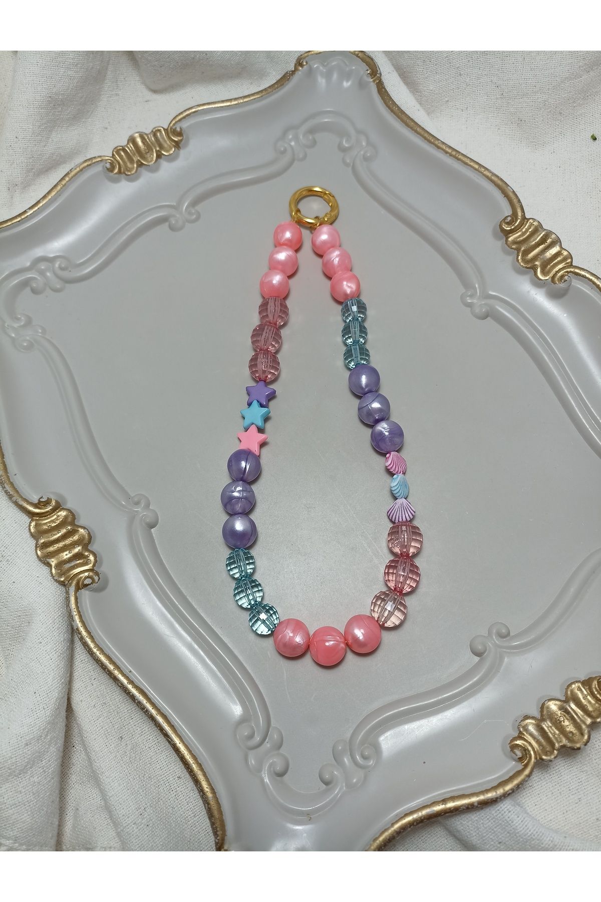 ida design store pembe ve mor boncuklu yıldız ve deniz kabuğu detaylı çanta ve telefon charmı