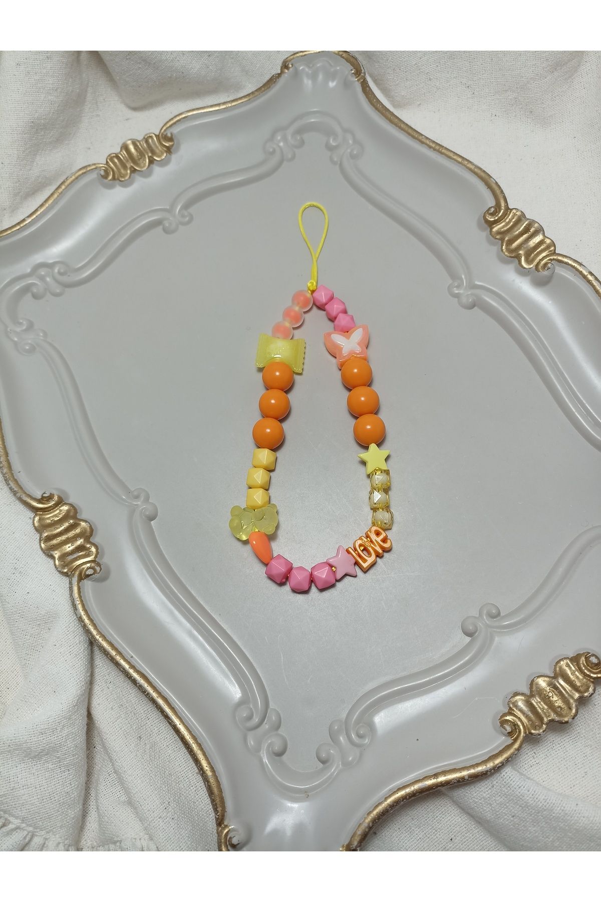 ida design store pembe sarı ve turuncu boncuklu ayıcık kelebek ve love detaylı çanta ve telefon charmı