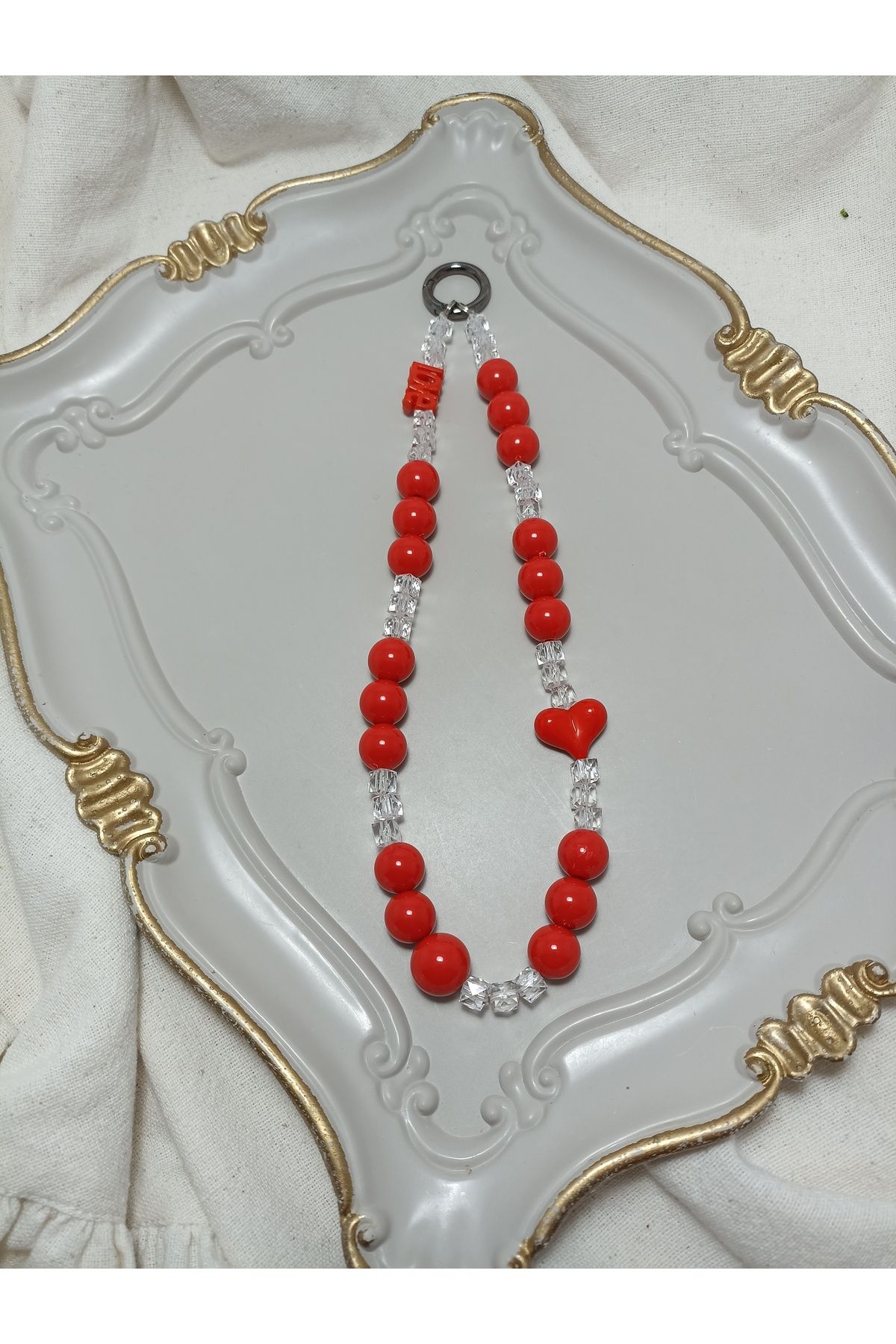 ida design store kırmızı boncuk ve kristal bonuk ile kalp detaylı çanta ve telefon charmı