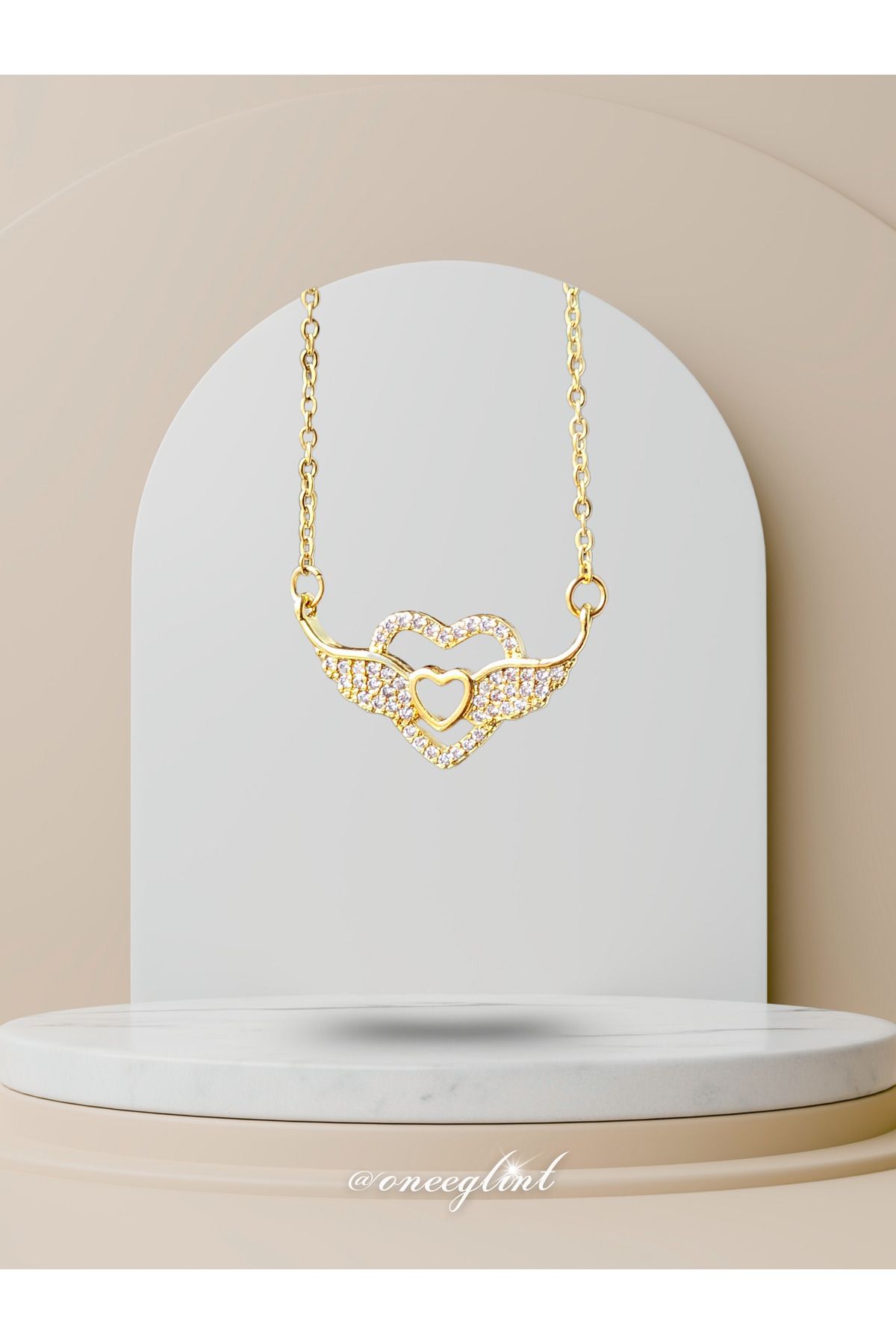 ONEE GLİNT GOLD KANATLI KALP | Çelik Kolye (𝑝𝑎𝑠𝑙𝑎𝑛𝑚𝑎𝑧, 𝑘𝑎𝑟𝑎𝑟𝑚𝑎 𝑦𝑎𝑝𝑚𝑎𝑧)