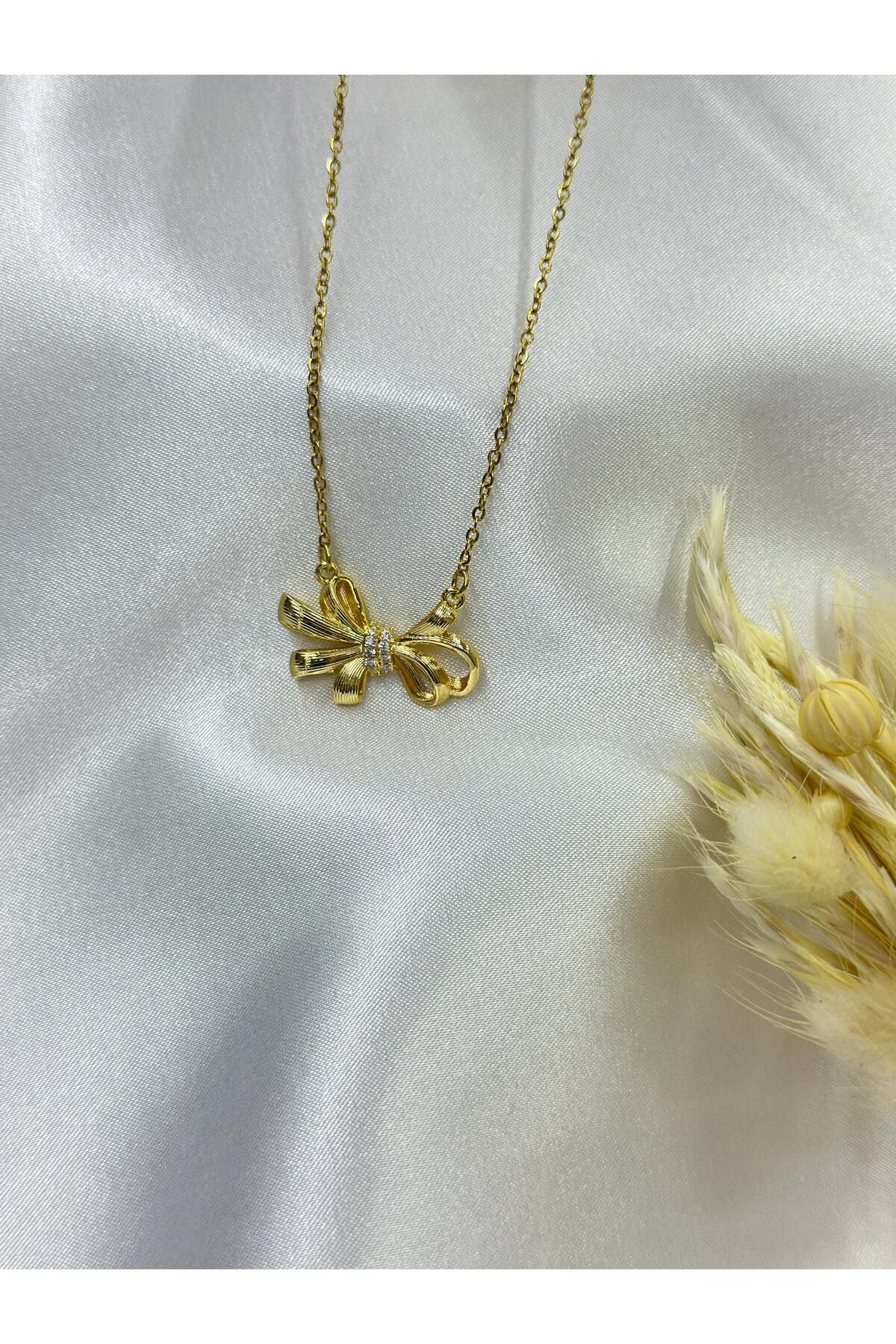melif accesories Gold Renk Ortası Zirkon Taşlı Fiyonk Figürlü Çelik Kolye