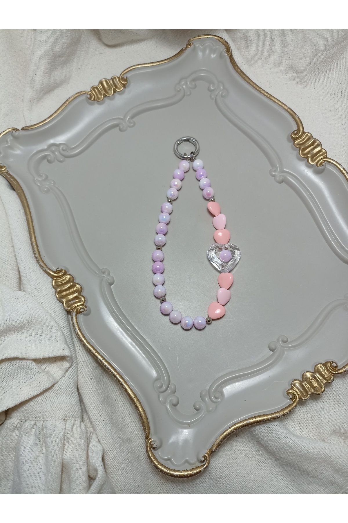 ida design store pembe inci ve pembe kalp detaylı çanta ve telefon charmı