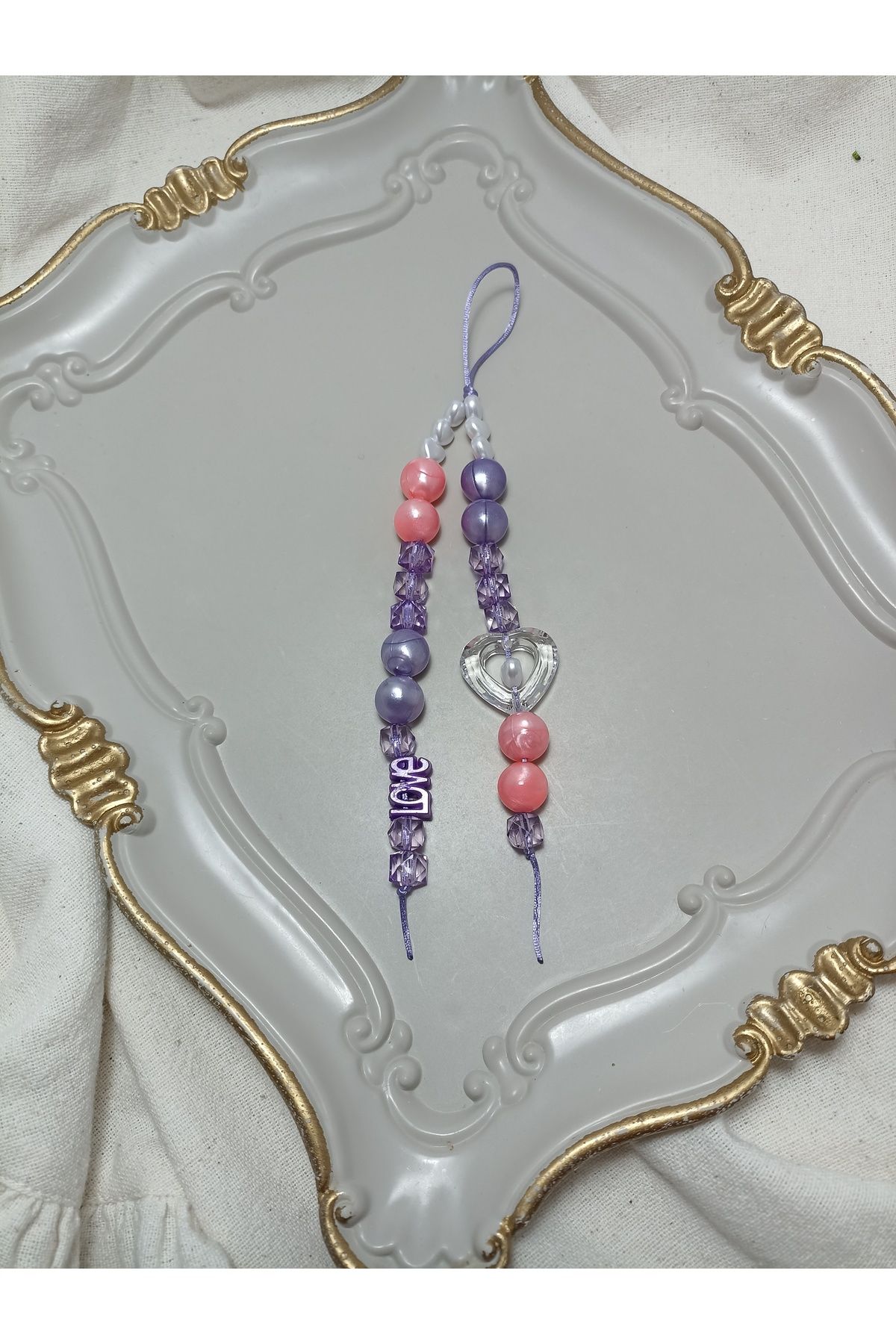 ida design store mor ve pembe boncuk ile kalp ve love detaylı çanta ve telefon charmı