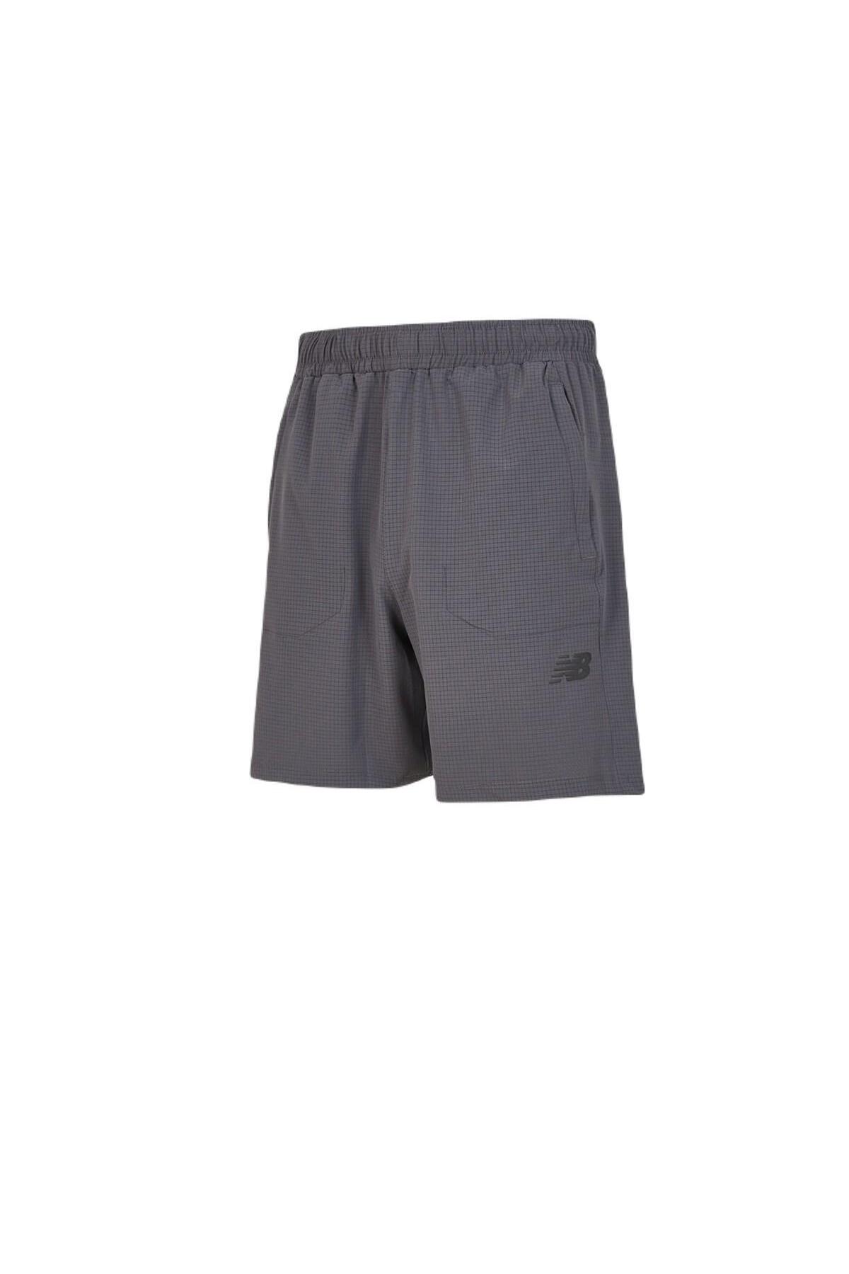 شورت ورزشی مردانه MNS1446-ANT رنگ آنتراسیت نیو بالانس شورت ورزشی New Balance