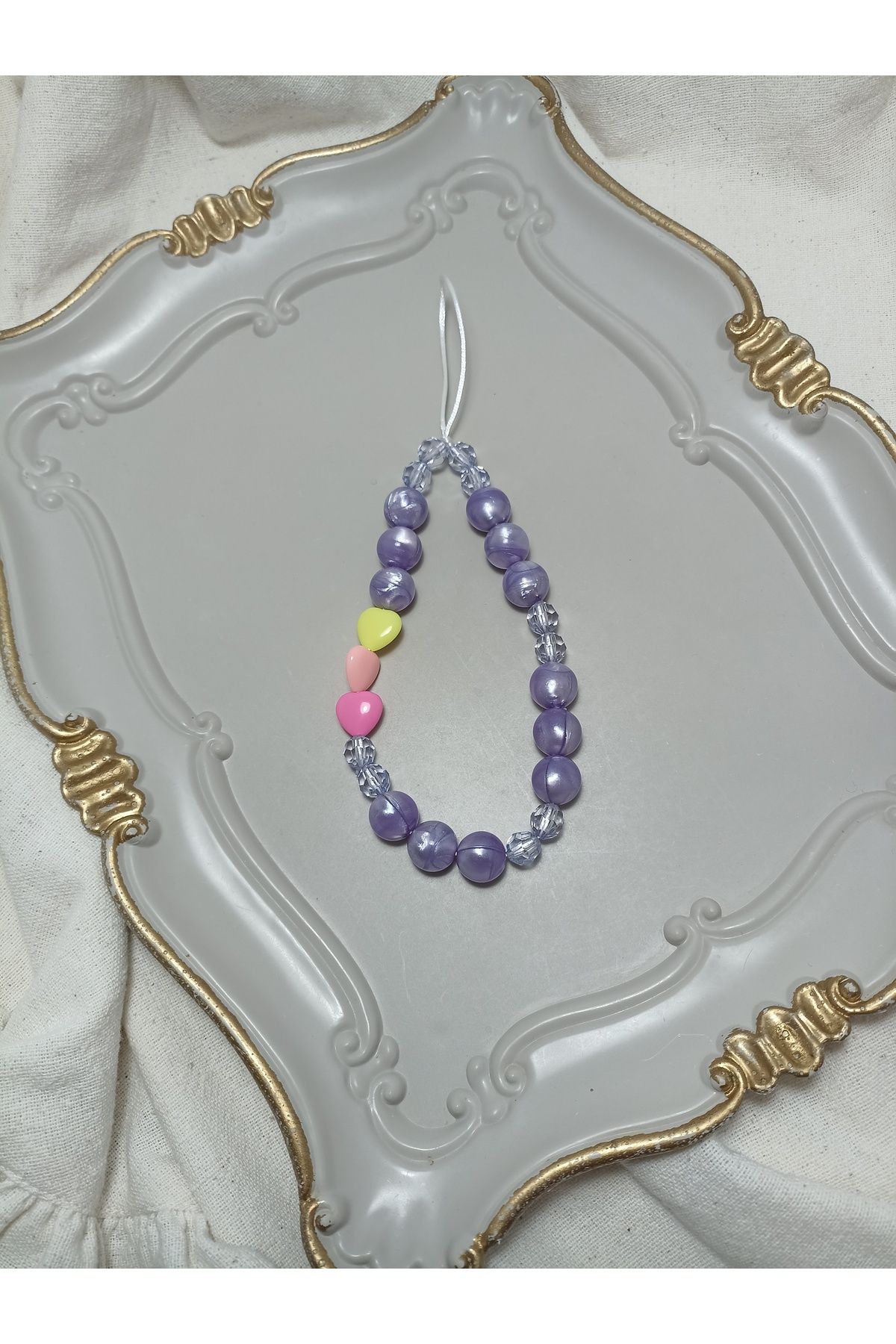 ida design store mor boncuklar ile renkli kalpler detaylı çanta ve telefon charmı