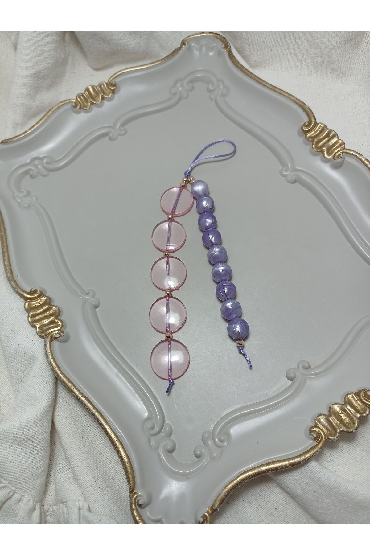 ida design store mor boncuk ve pembe halka detaylı çanta ve telefon charmı