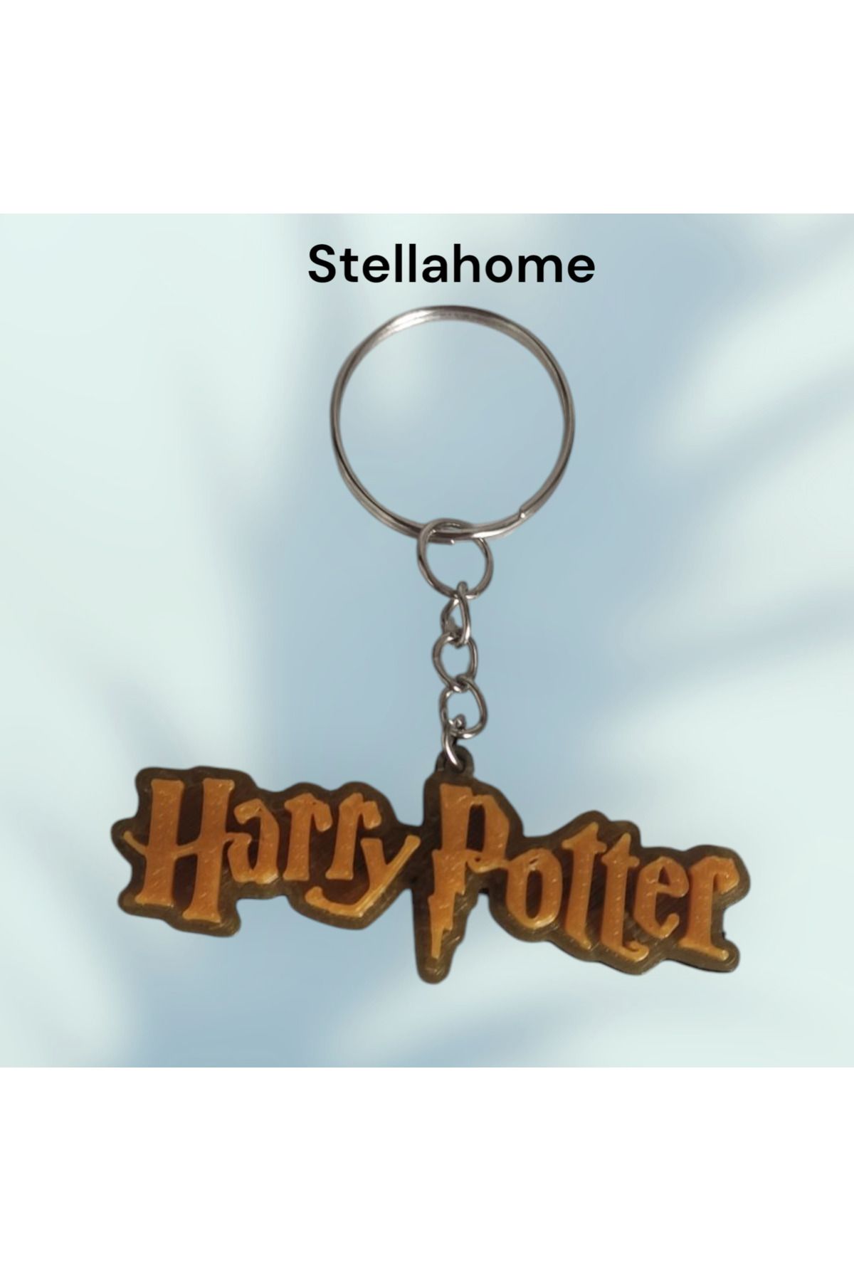 Bujiteri Altın renk detaylı harry potter yazılı anahtarlık
