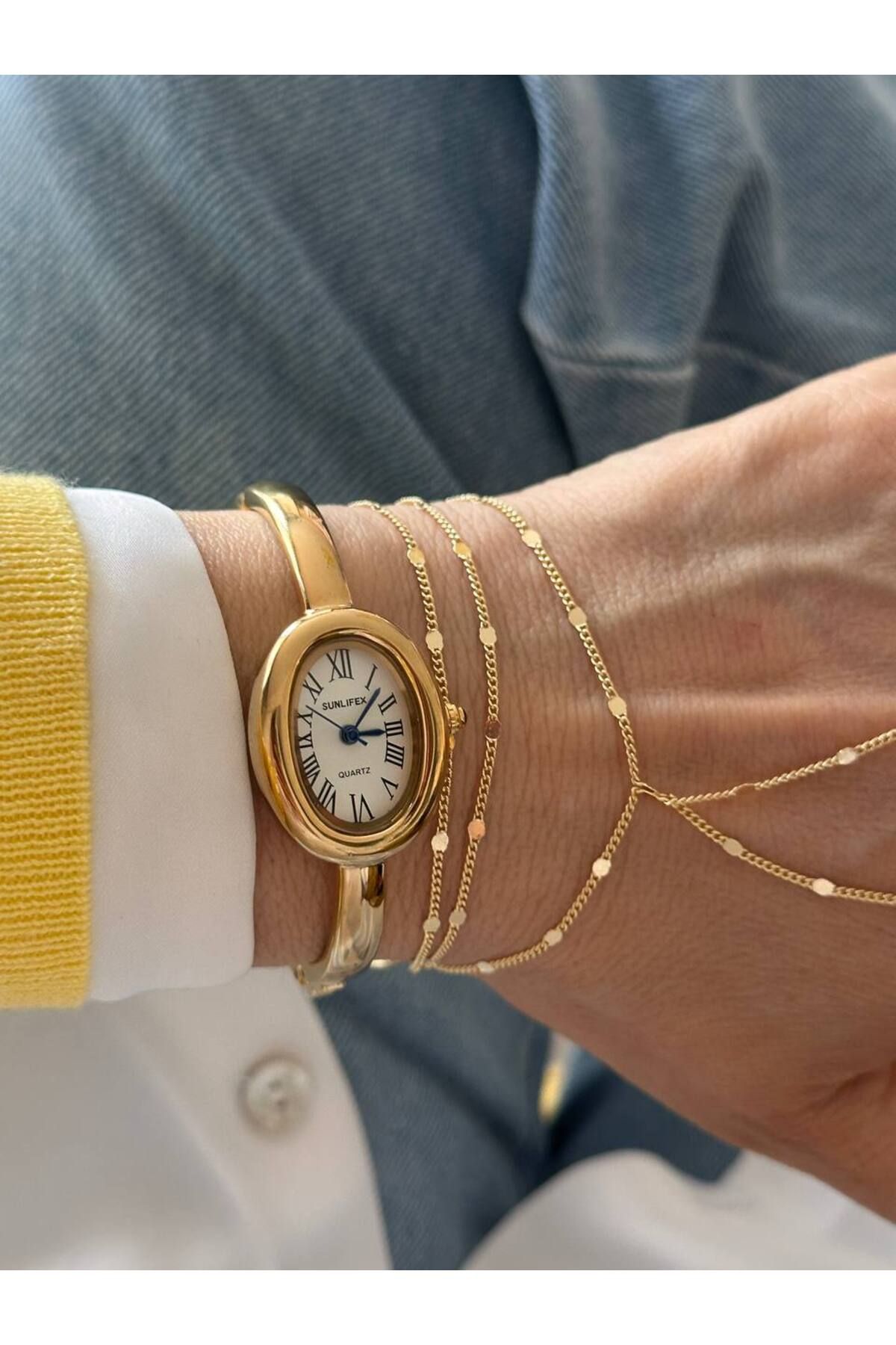 Esmeray Aksesuar Paslanmaz Çelik Gold Renk Beyaz Kadranlı Roma Rakamlı Kelepçe Model Kadın Kol Saati Genişlik 5,5 cm.