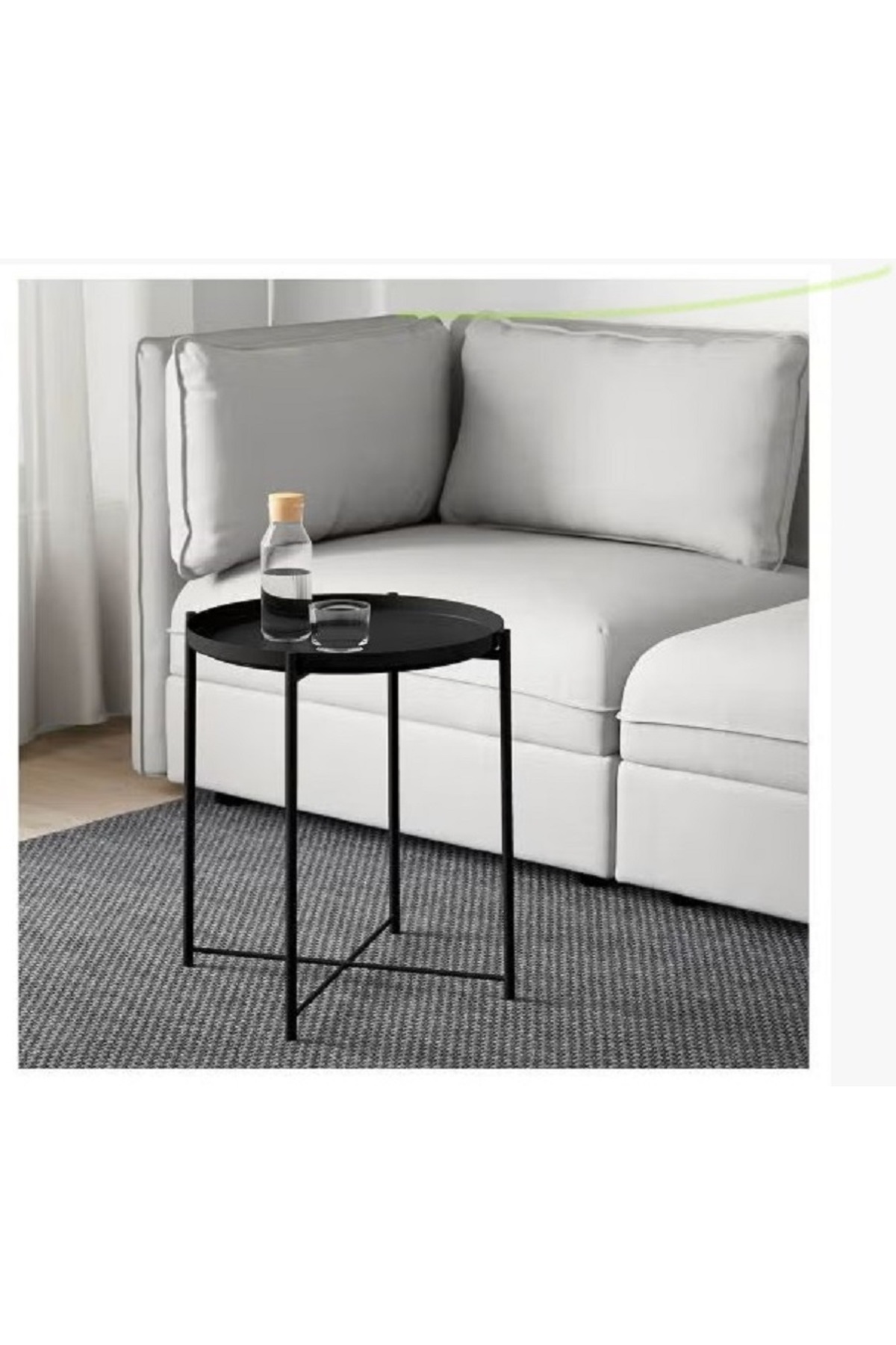 طاولة فولاذية مستديرة باللون الأسود