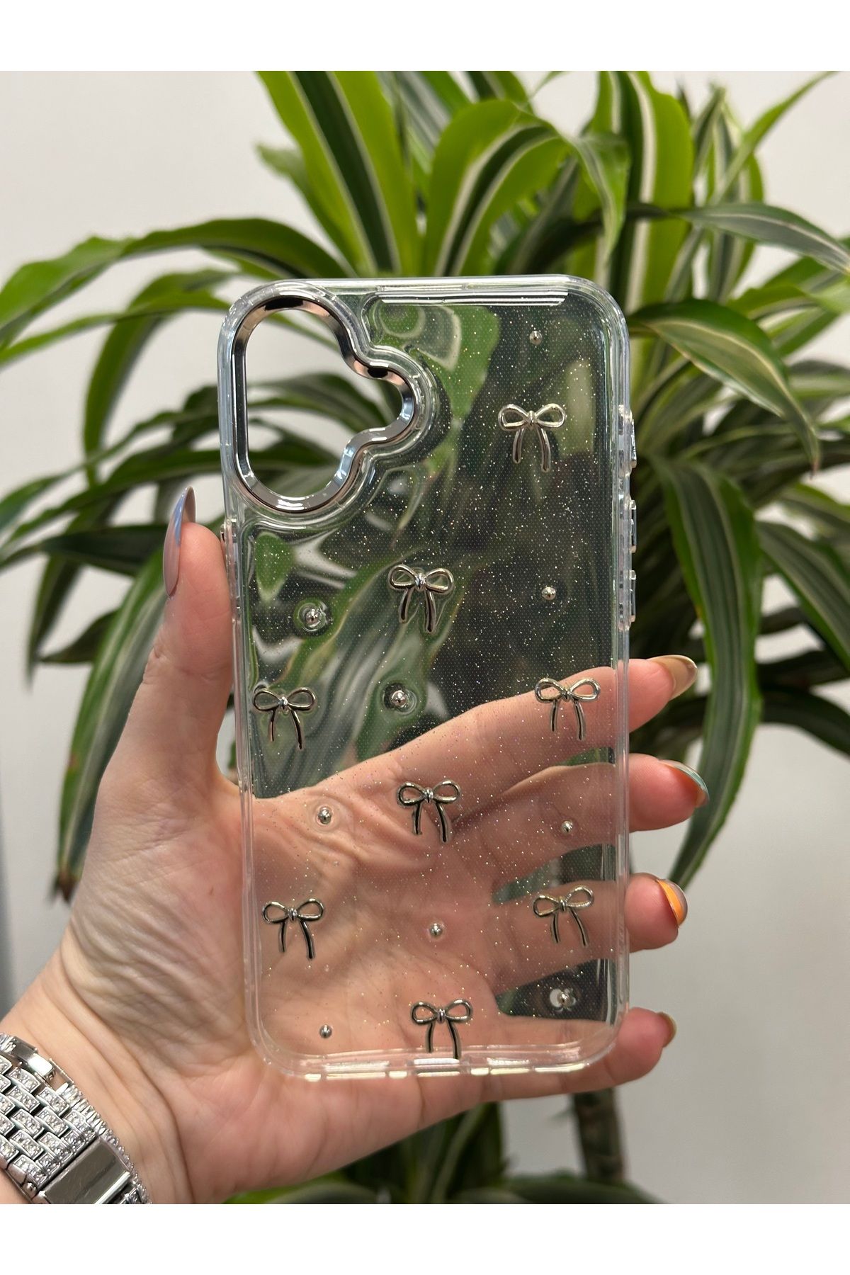 Qans Bilisim İphone 16 Plus Simli ve Kurdele Detaylı Şeffaf Kılıf