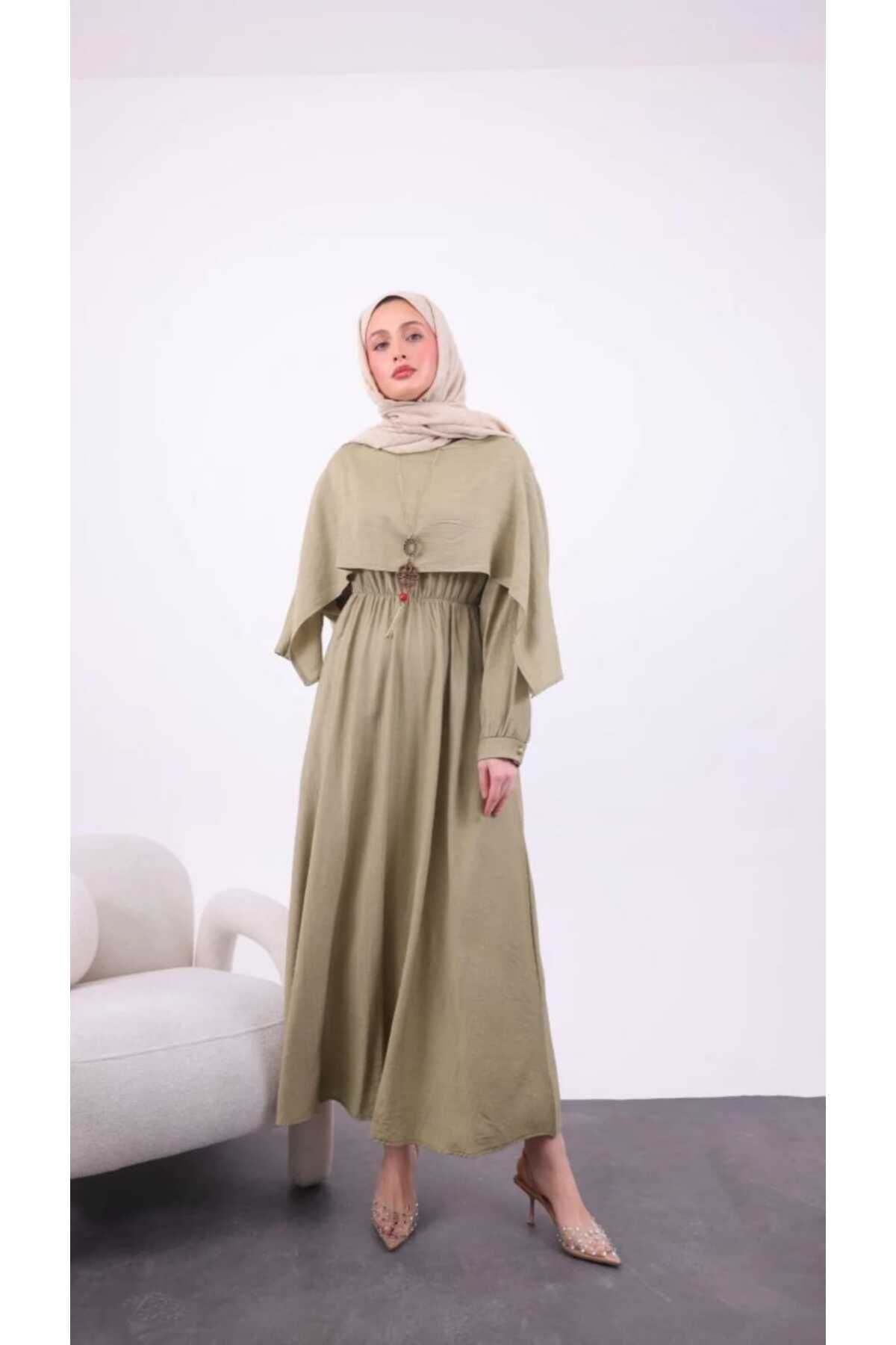 Butik pelerinli asimetrik kolyeli elbise