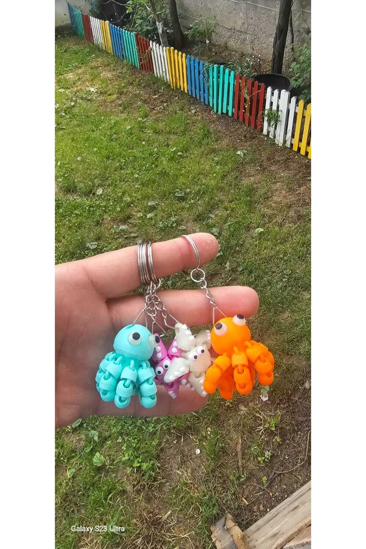 3DBASKILAR 2 fosfor göz ahtapot(florasan sarı ve gold) 2 deniz yıldızı (turuncu ve pembe) anahtarlık 3D