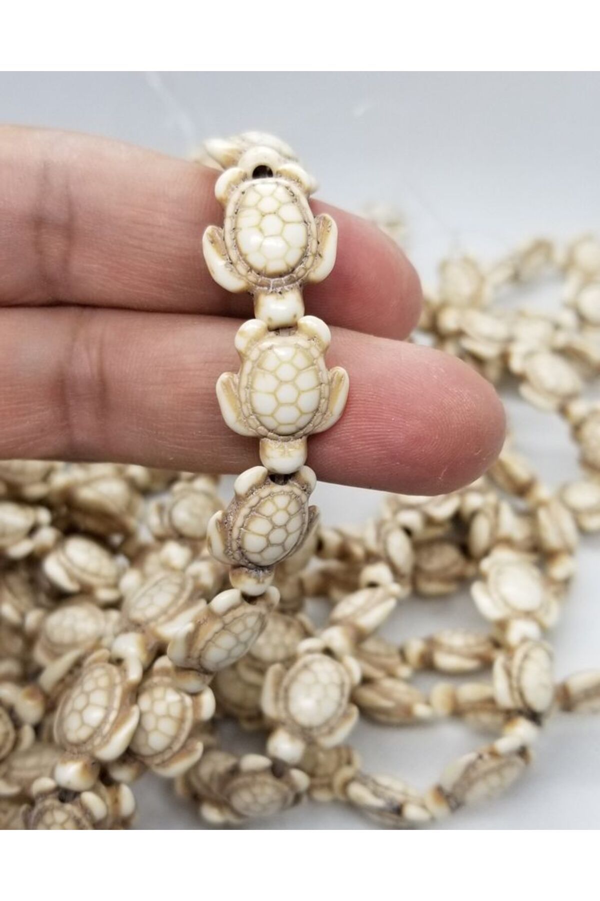 Ellanın Çarşısı Kaplumbağa Krem Renk Boncuk Seramik 1 dizi 22 adet . Ölçüsü : 1,5 cm x 1.10 cm