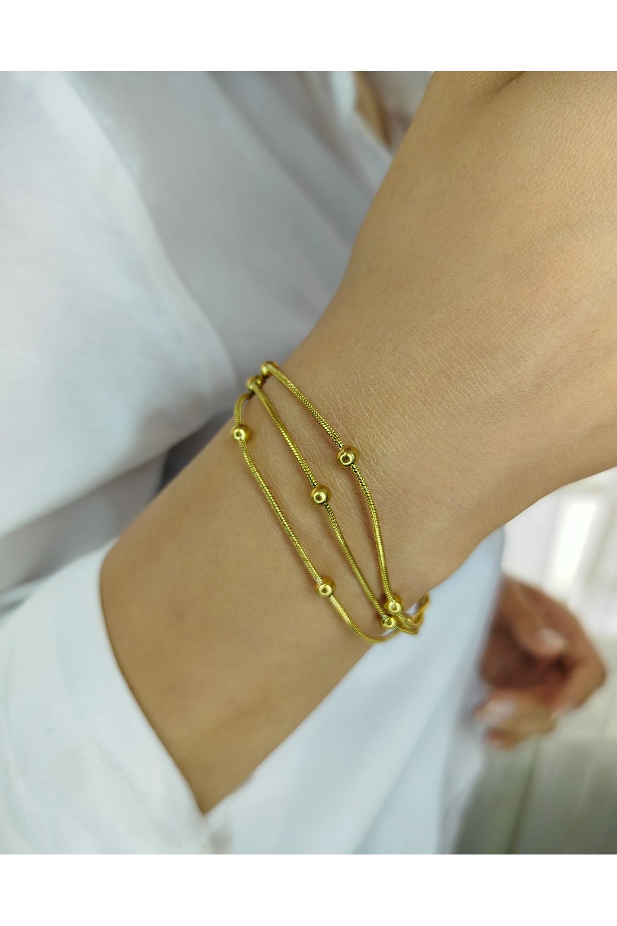 Nova Riva Gold Renkli Üçlü Bağımsız Zincir Ve Yuvarlak Detayları Olan Paslanmaz Çelik Kadın Bileklik
