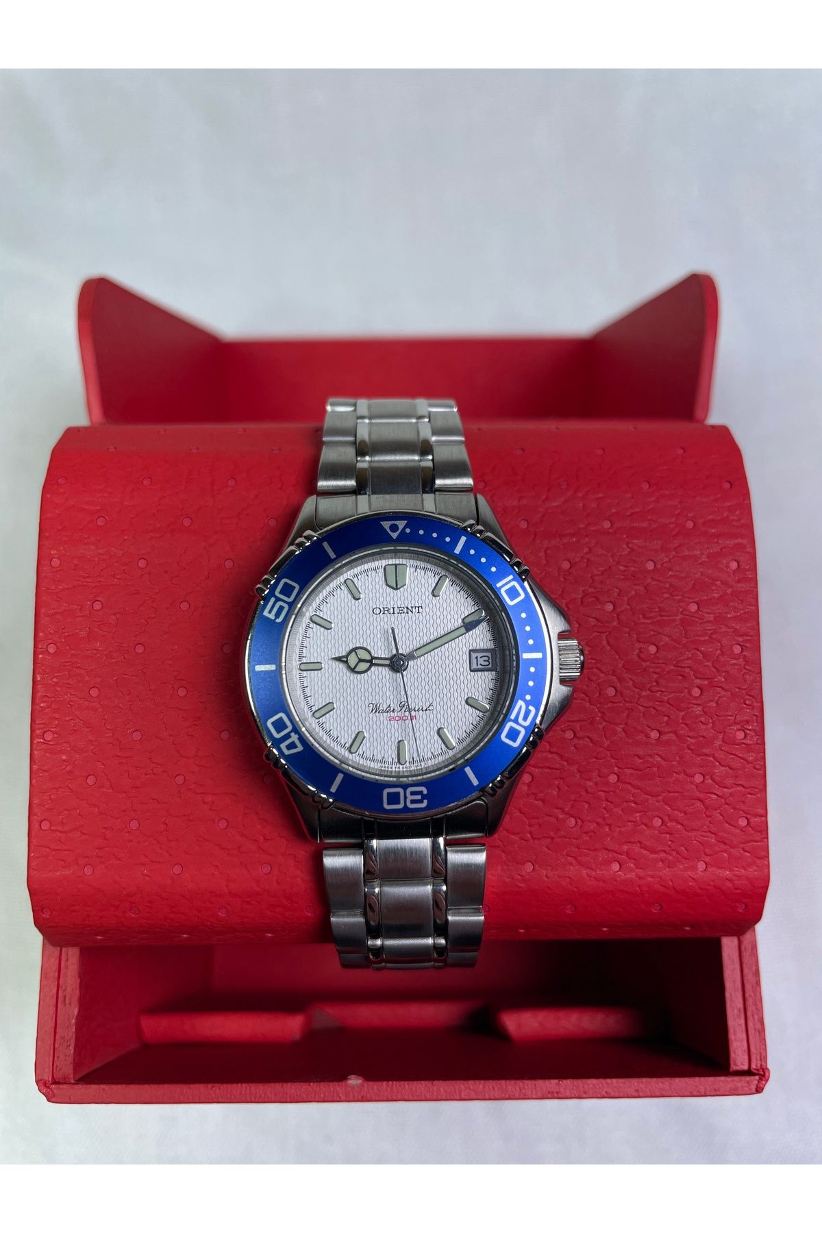 Orient BS902025112A Retro Model Mavi Çerçeveli Takvimli Gri Kadranlı Şık Erkek Kol Saati