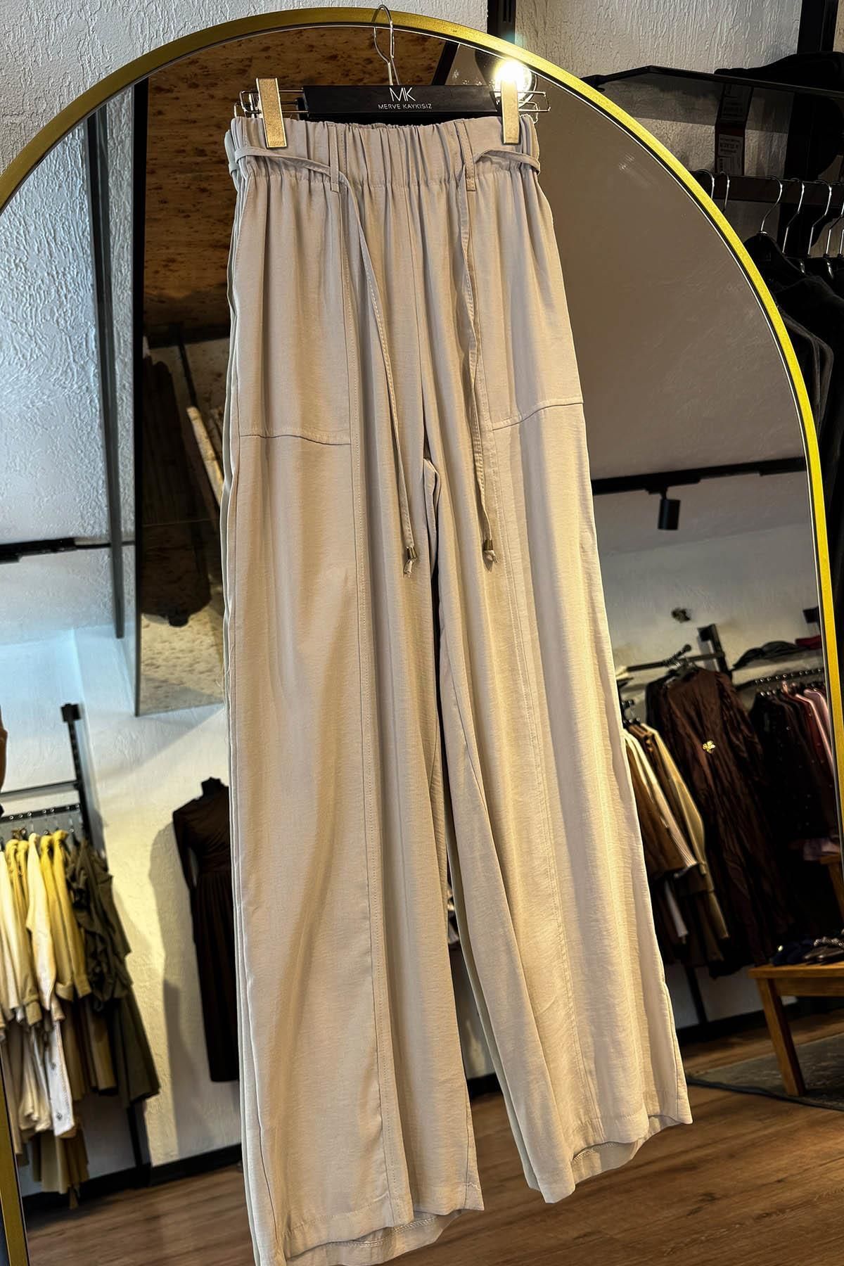 MERVE KAYKISIZ Beli Lastikli Bol Pantolon Bej