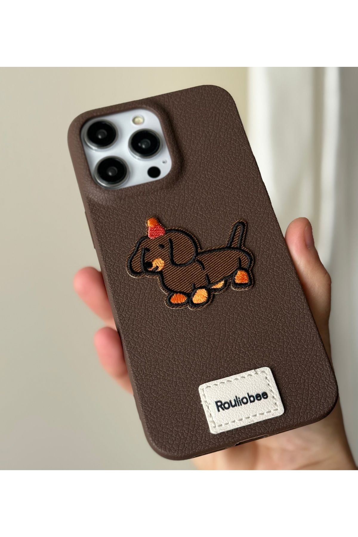 FİŞNEİLETİŞİM İPHONE 15 PRO UYUMLU DERİ GÖRÜNÜMLÜ NAKIŞLI KILIF