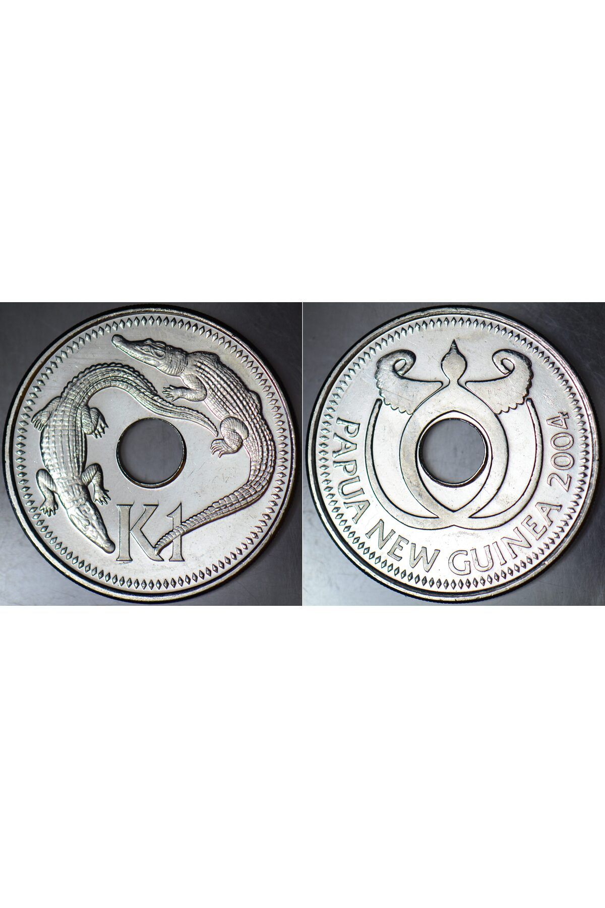 Banknoting PAPUA YENİ GİNE 1 KİNA 2004 TATLI VE TUZLU SU TİMSAHI TEMALI DELİKLİ PARA. ÇİL KONDİSYON.