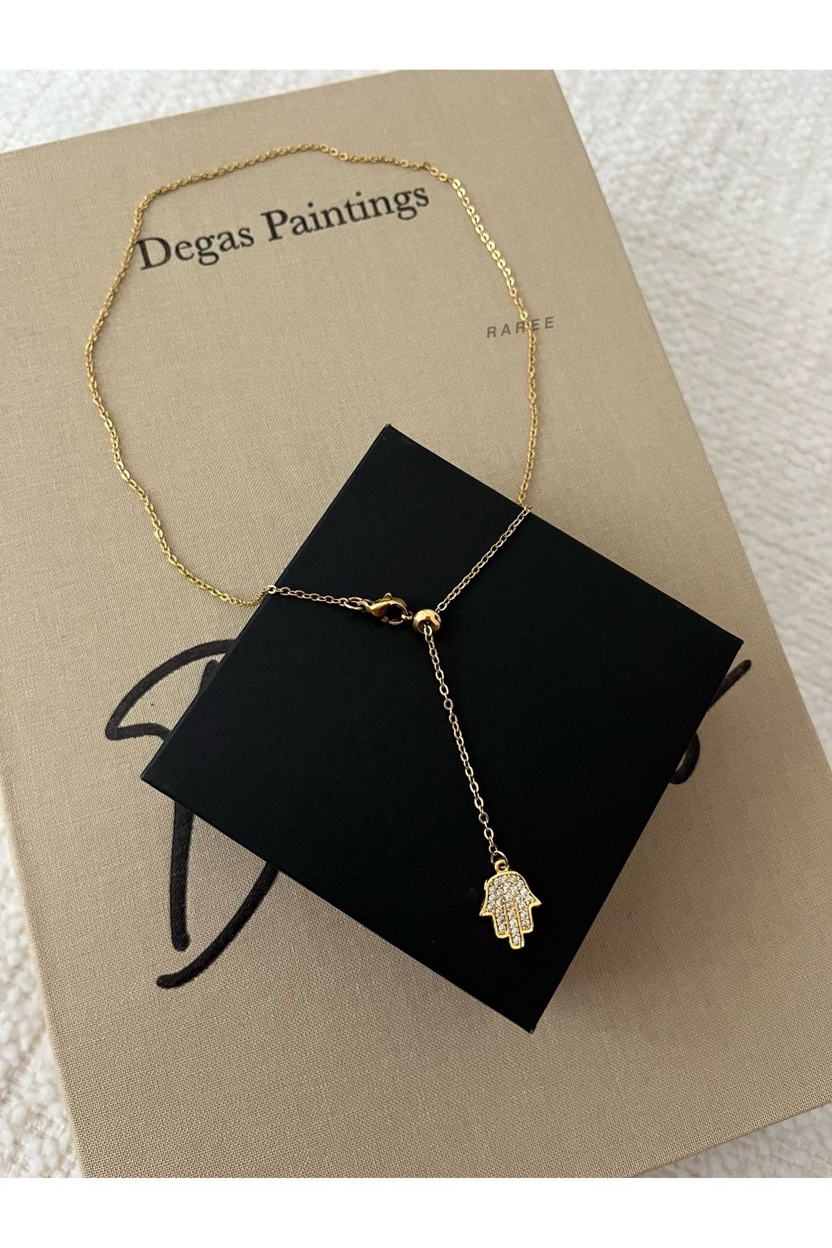 Raree Jewellery Asansörlü zirkon taşlı fatma ana eli hamsa sallantılı çelik zincirli kolye