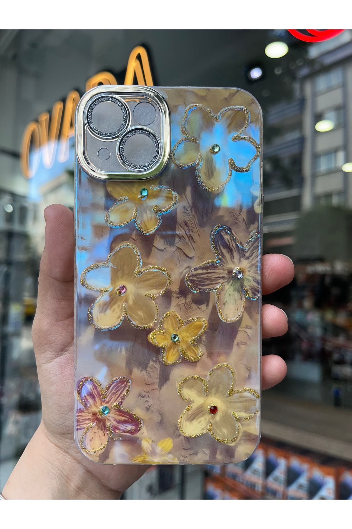 OVADA İPhone 13/14 Uyumlu Simli Kamera Korumalı Çiçek Desenli Taşlı Hologramlı Lüks Kılıf