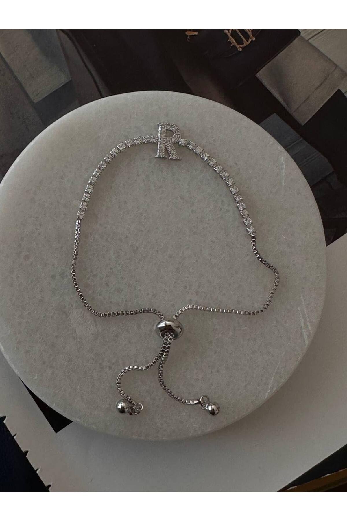 Esmeray Aksesuar Gümüş Renk Zirkon Taşlı Rodyum Kaplama ( R ) Harfli Su Yolu Asansör Bileklik