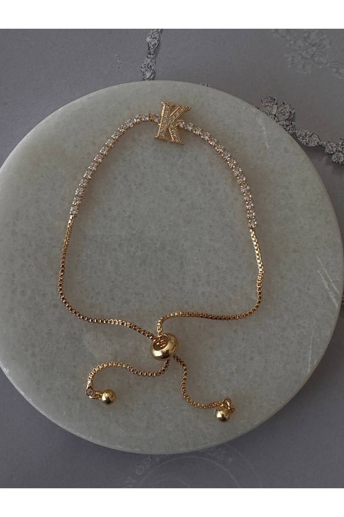 Esmeray Aksesuar Gold Renk Zirkon Taşlı Rodyum Kaplama ( K ) Harfli Su Yolu Asansör Bileklik