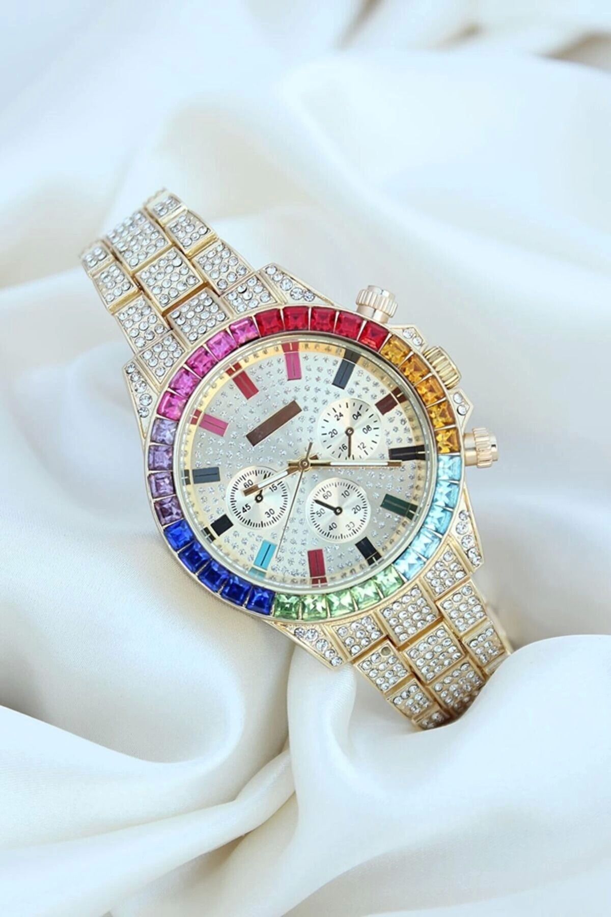 Vemora Clariss Trend Gold Metal Kordonlu Zirkon Taş Kaplama Renkli Taşlı Kasa Tasarımlı Lüx Kadın Kol Saati